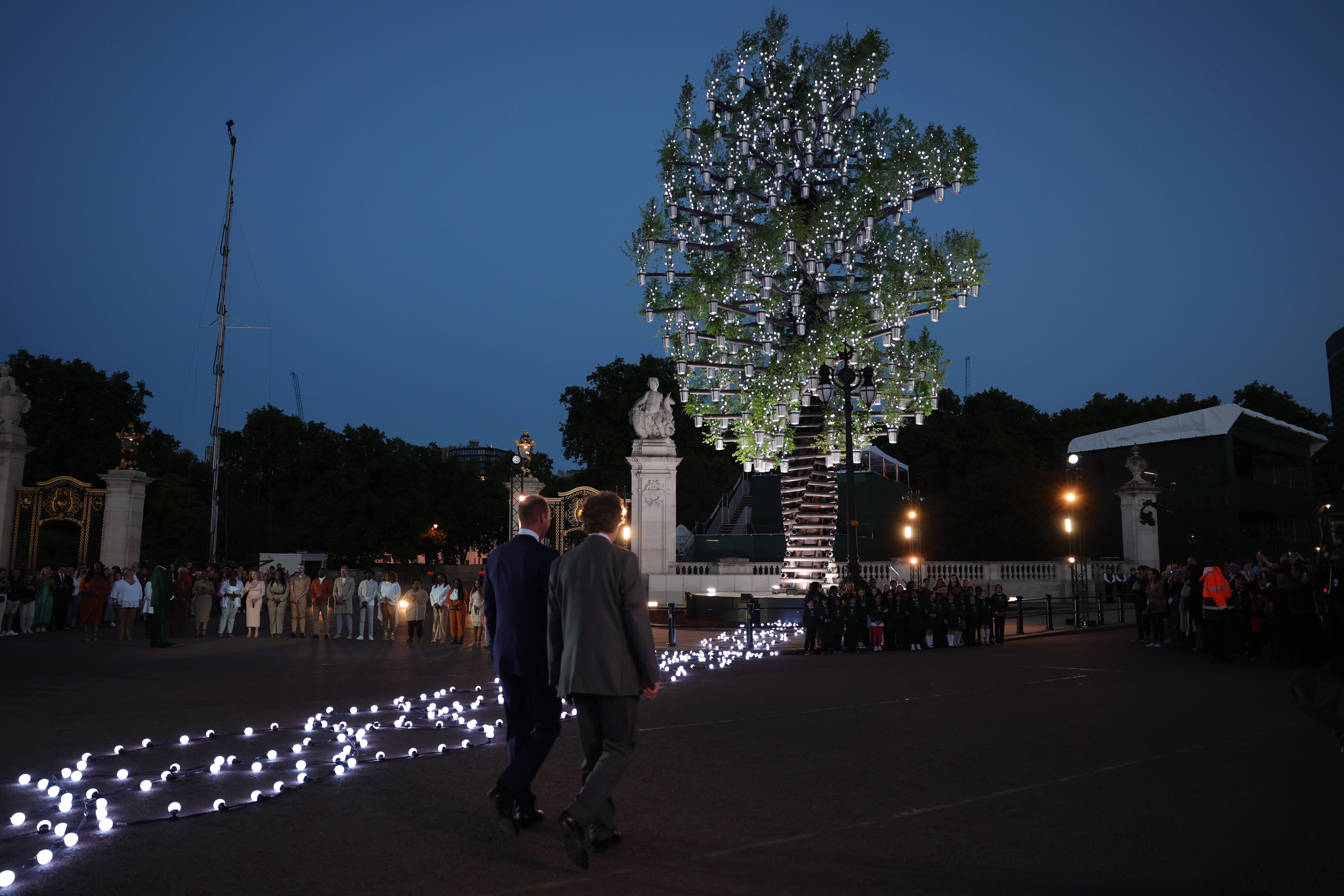 William and Sir Nicholas Bacon at the lighting of the principal beacon at the Tree of Trees sculpture outside Buckingham Palace (Chris Jackson/PA)