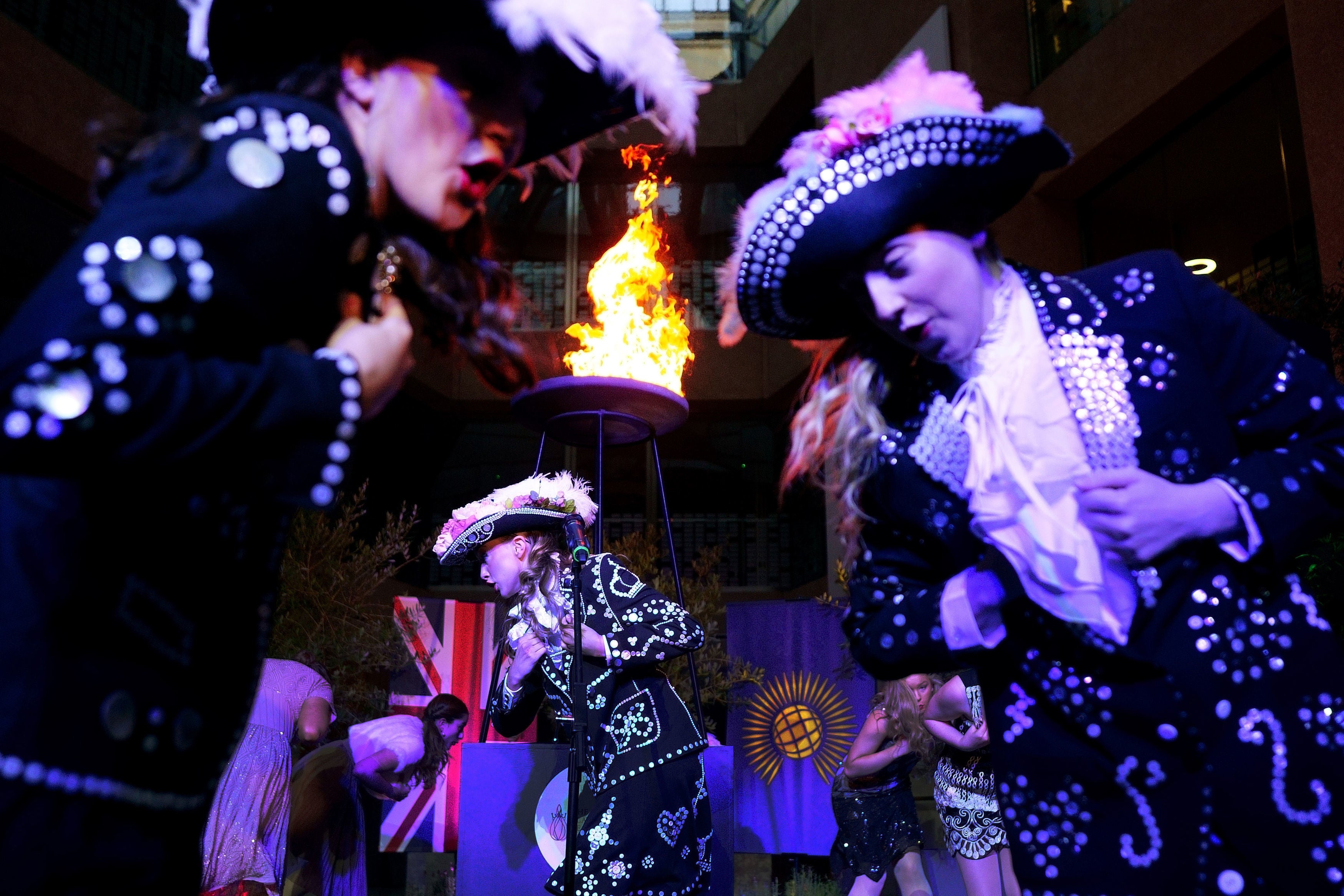 Song and dance troupe the West End Kids perform in front of a Platinum Jubilee beacon after it was lit at Coutts bank in central London