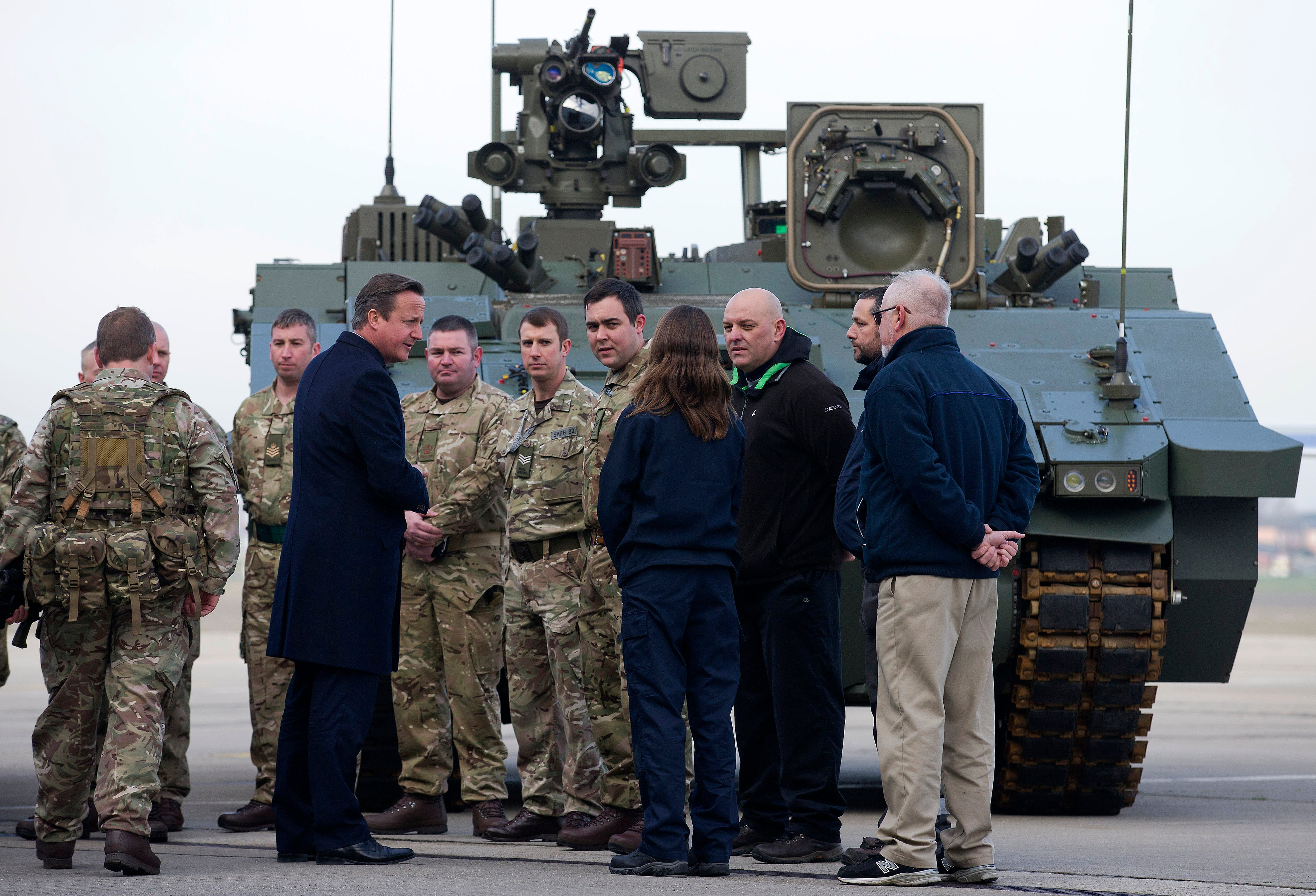 Then-prime minister David Cameron with soldiers from the Royal Welsh Infantry in front of an Ajax vehicle at RAF Northolt in 2015