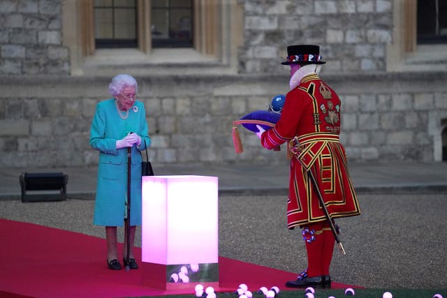 The Queen has symbolically led the lighting of the principal Platinum Jubilee beacon in a spectacular end to the first day of historic national commemorations celebrating her 70-year-reign (Steve Parsons/PA)