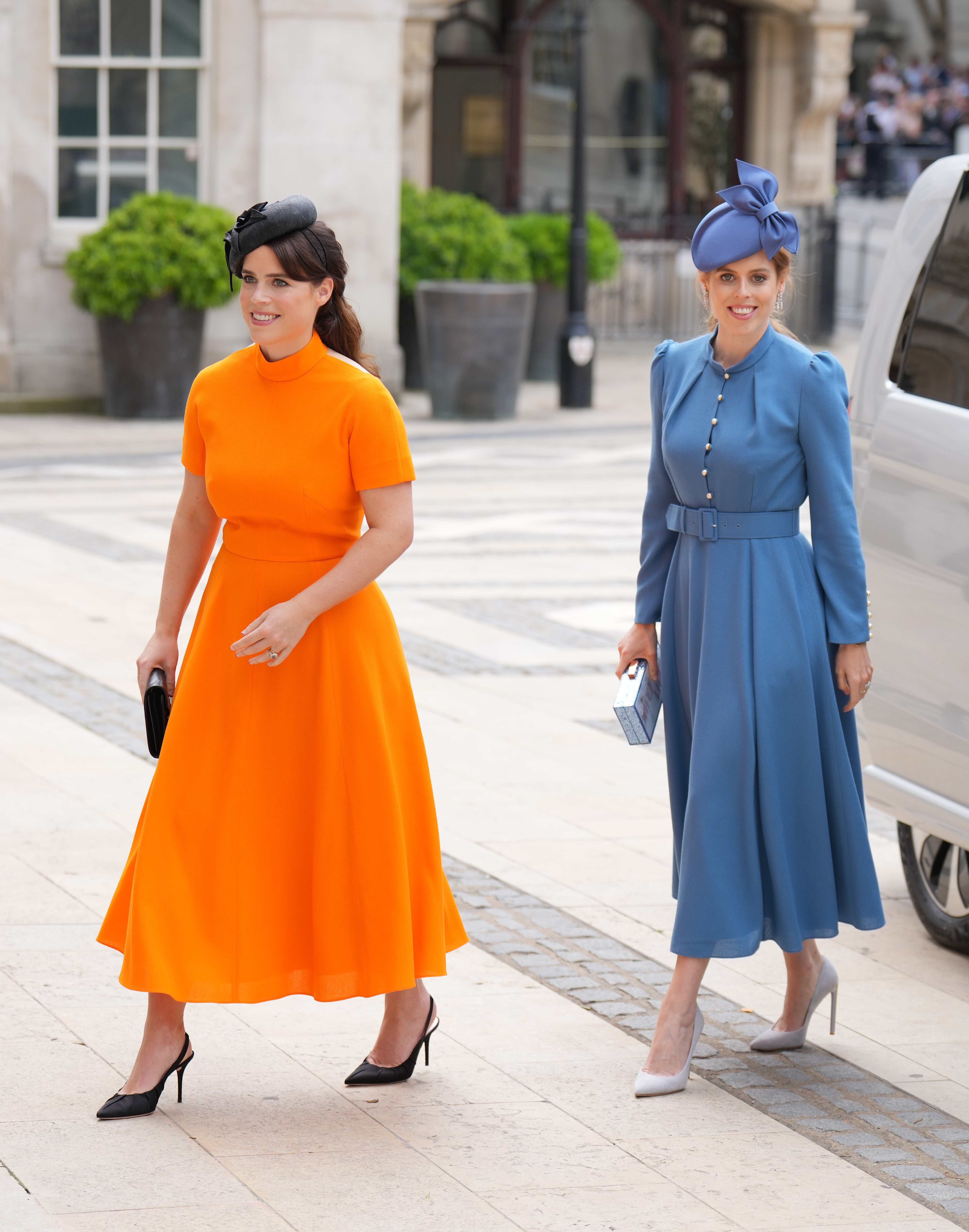 Princesses Beatrice and Eugenie wore bright blue and orange (Victoria Jones/PA)