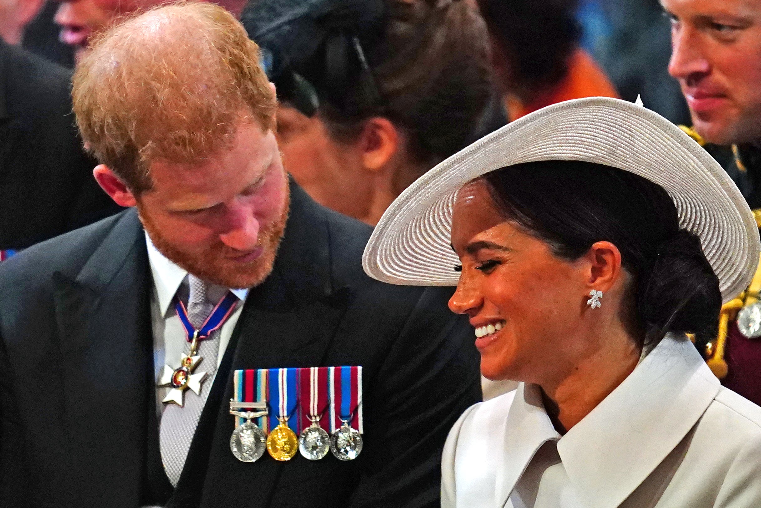 The Duke and Duchess of Sussex share a smile before the service began (Victoria Jones/PA)