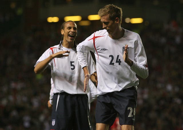 Peter Crouch, right, celebrates scoring (Gareth Copley/PA)