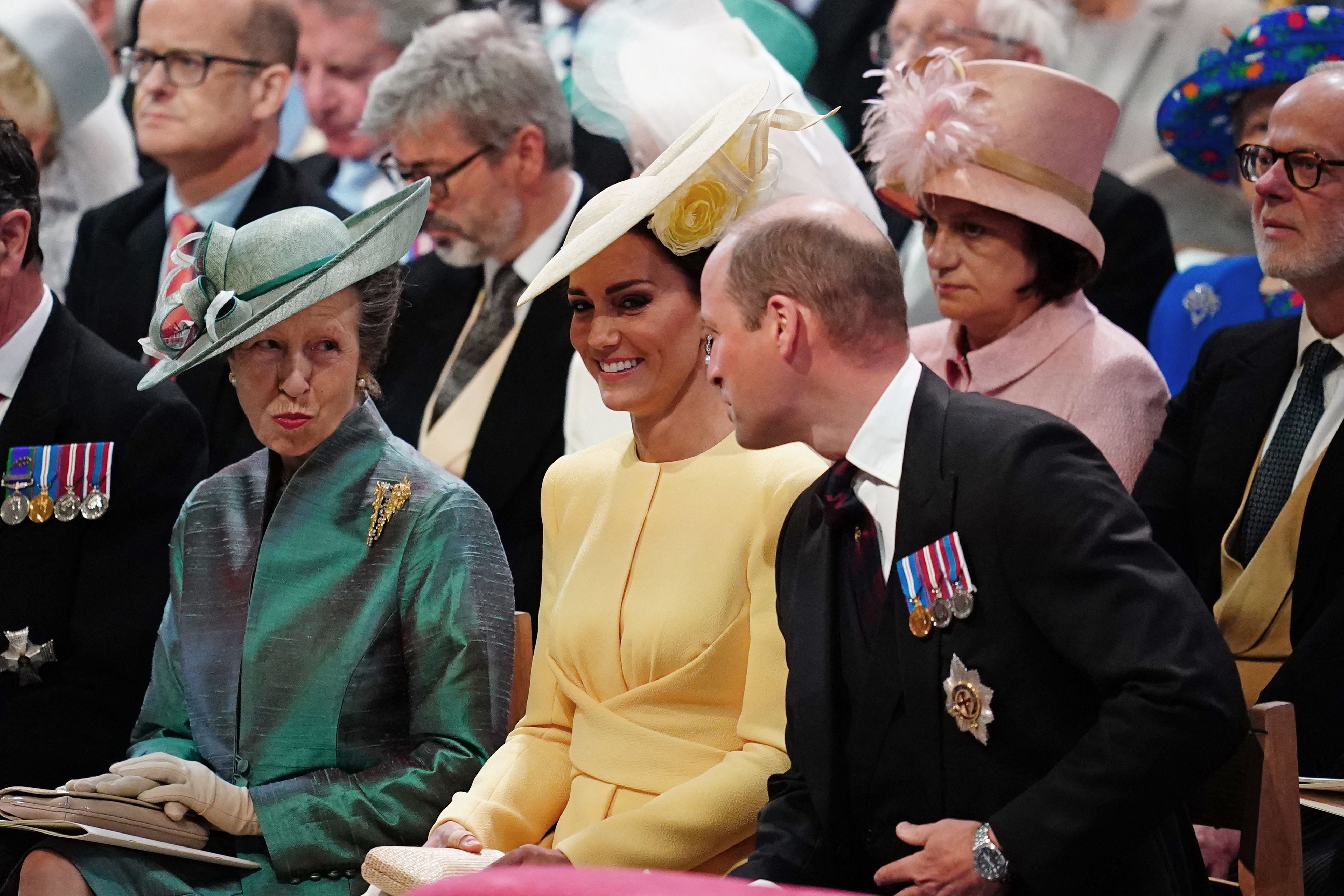Princess Anne and the Duke and Duchess of Cambridge share a joke before the service