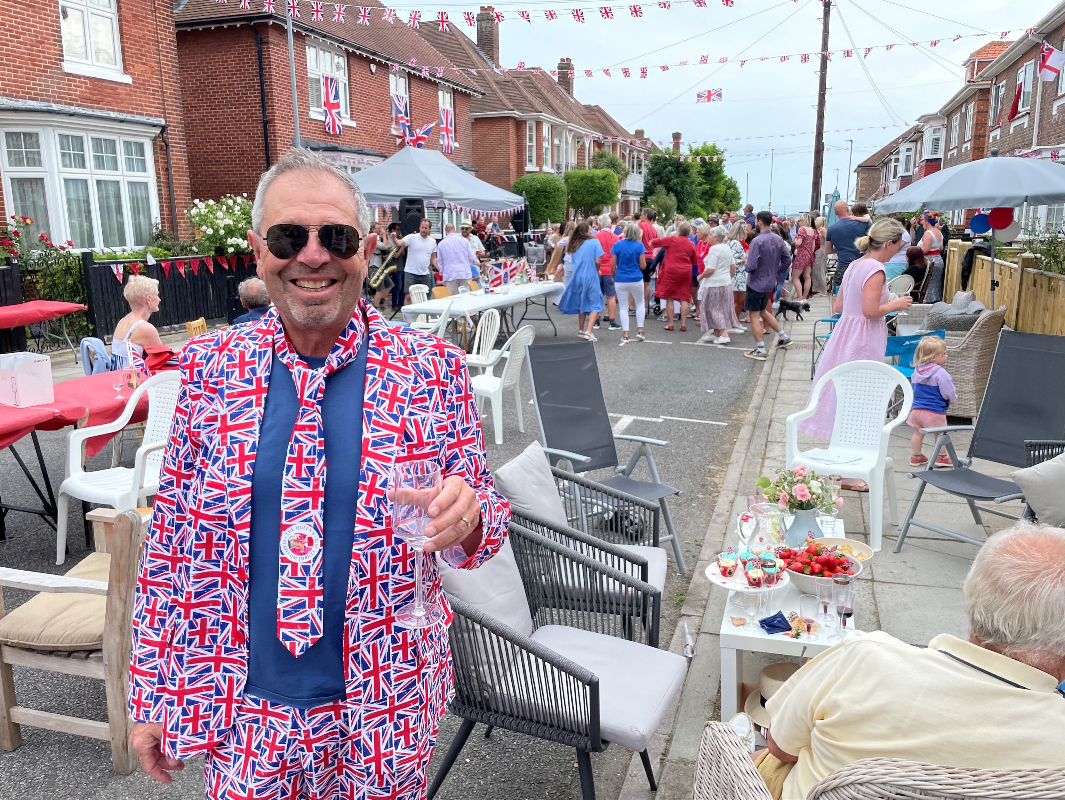 Paul Woolf, chief executive of the Kings Theatre, Southsea, enjoying a street party in Southsea, Hampshire