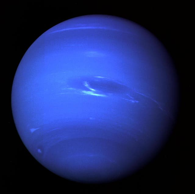 <p>The deep azure atmosphere of Neptune is apparent in this image taken by Voyager 2 in 1989</p>