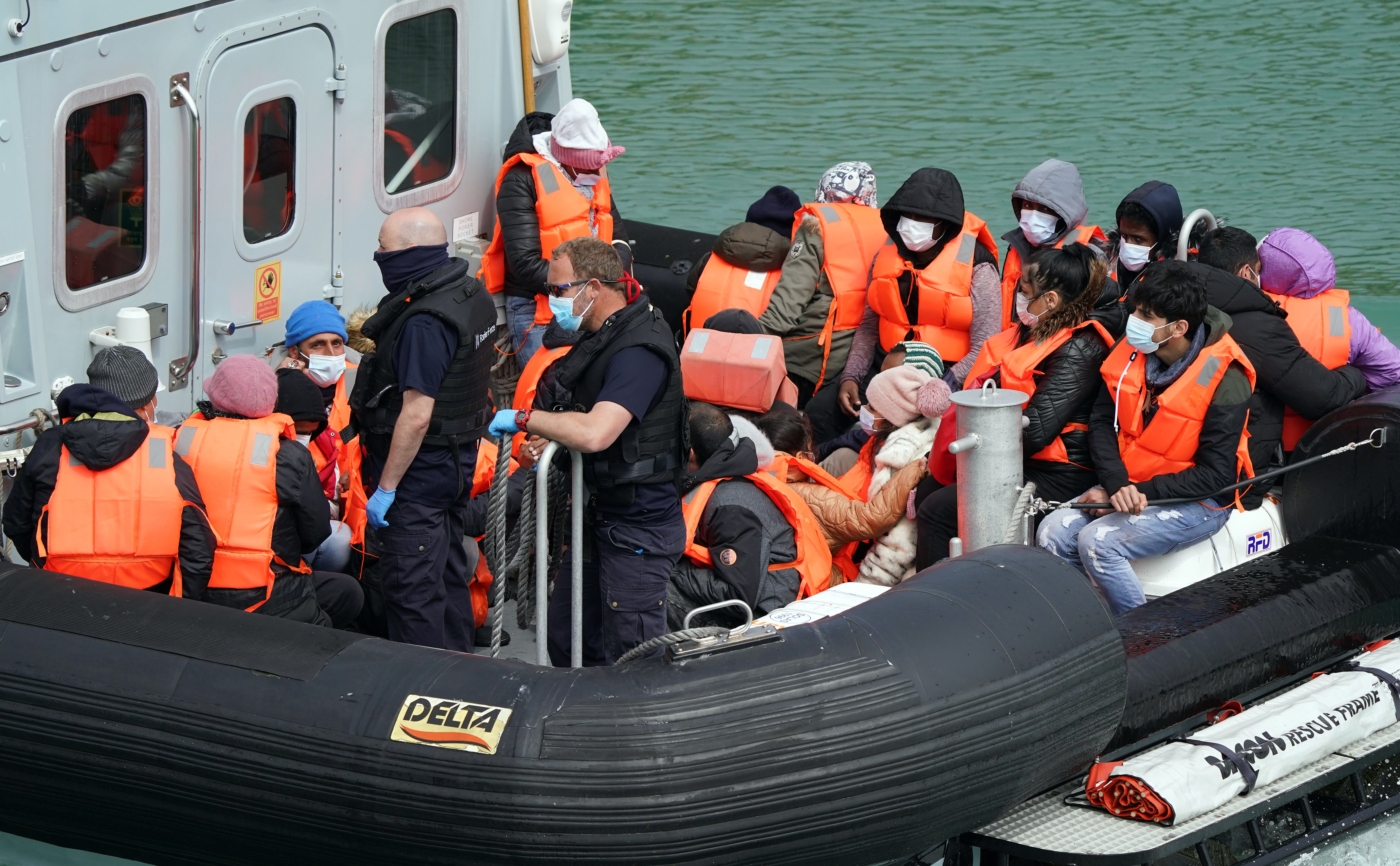 File image of a group of people thought to be migrants are brought in to Dover, Kent, by Border Force officers (Gareth Fuller/PA)