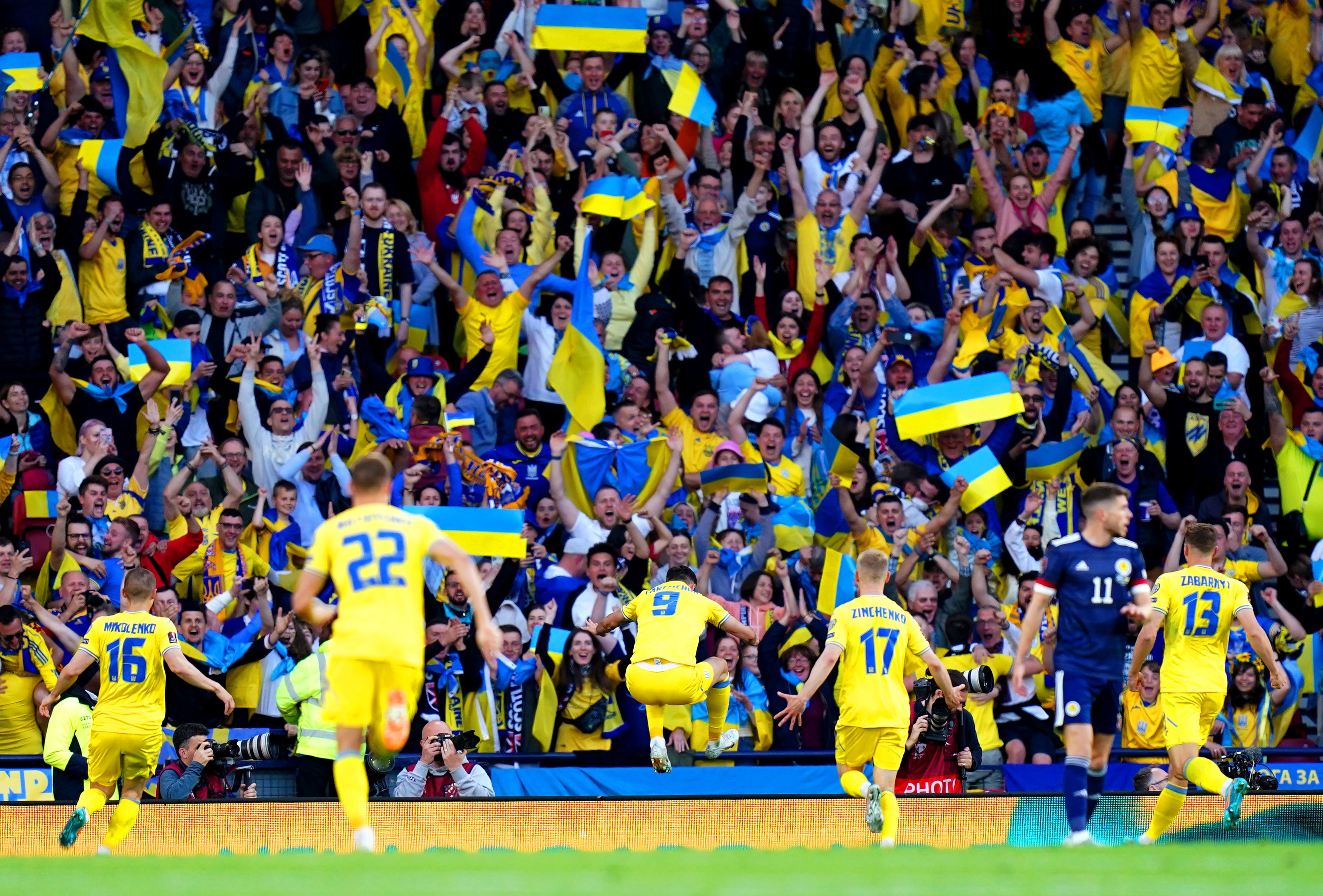 Ukraine players and fans celebrate Roman Yaremchuk (centre) scoring in the 3-1 World Cup play-off win against Scotland at Hampden Park (Jane Barlow/PA)