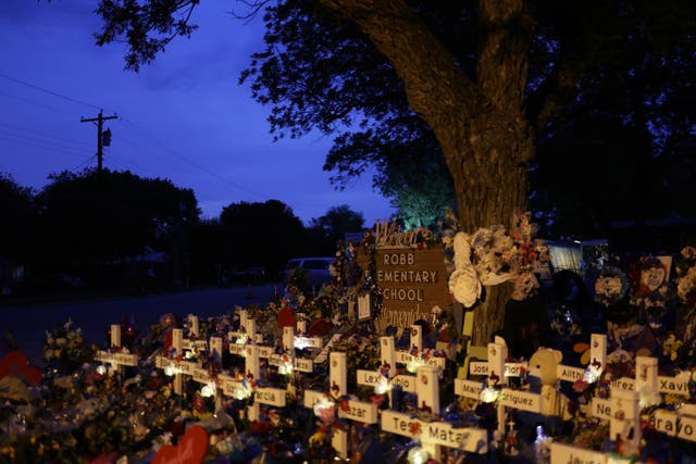 <p>Wooden crosses are placed at a memorial dedicated to the victims of the mass shooting at Robb Elementary School </p>