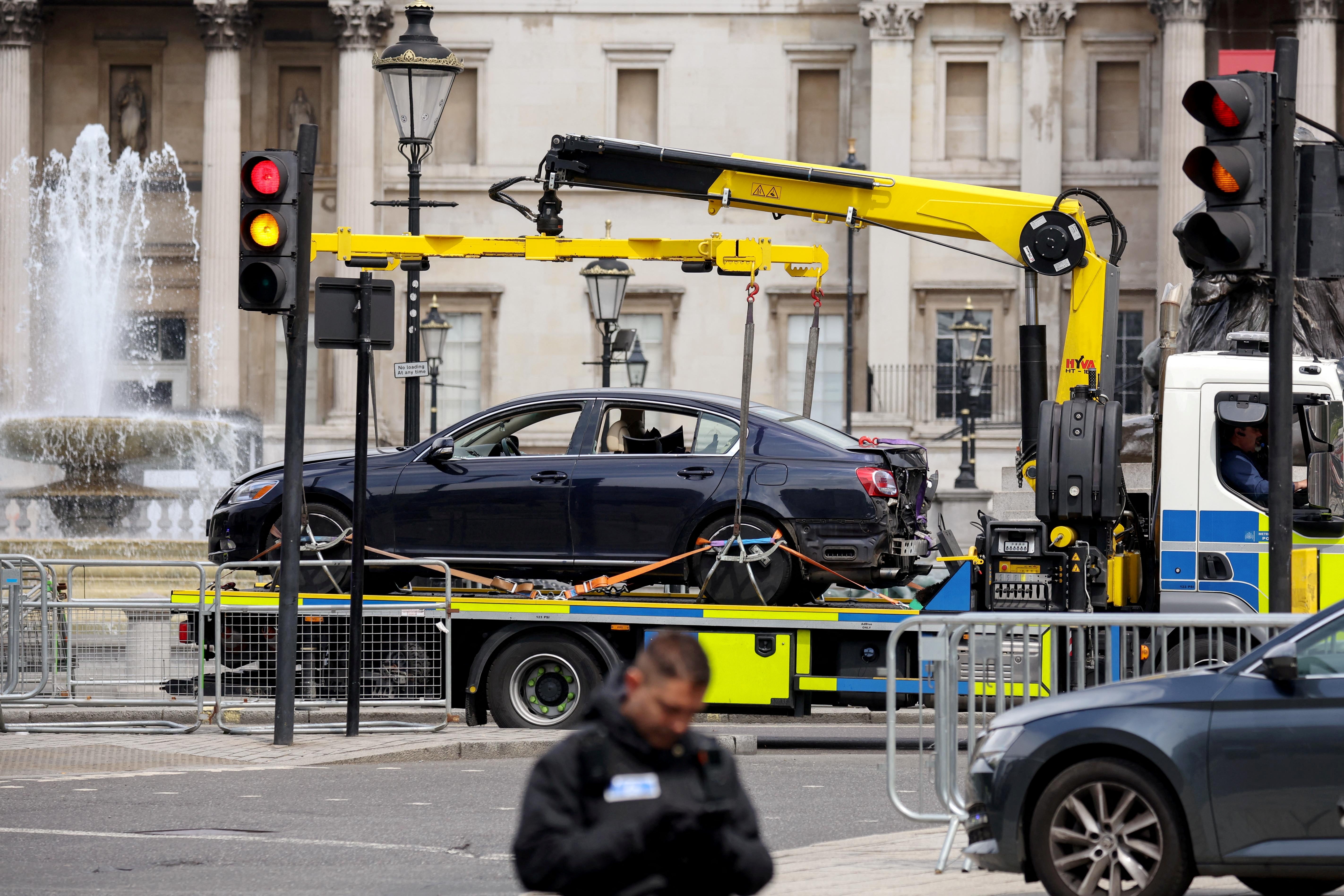 Police tow away a car from Trafalgar Square in central London