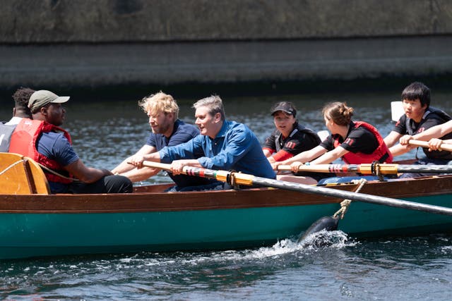 <p>Labour leader Sir Keir Starmer helps to row a boat on the River Lea</p>