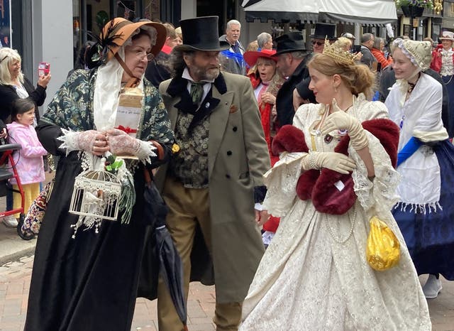 People dressed as Dickensian literary characters take part in parade at the Platinum Jubilee Dickens Festival in Rochester (Katie Boyden/PA)