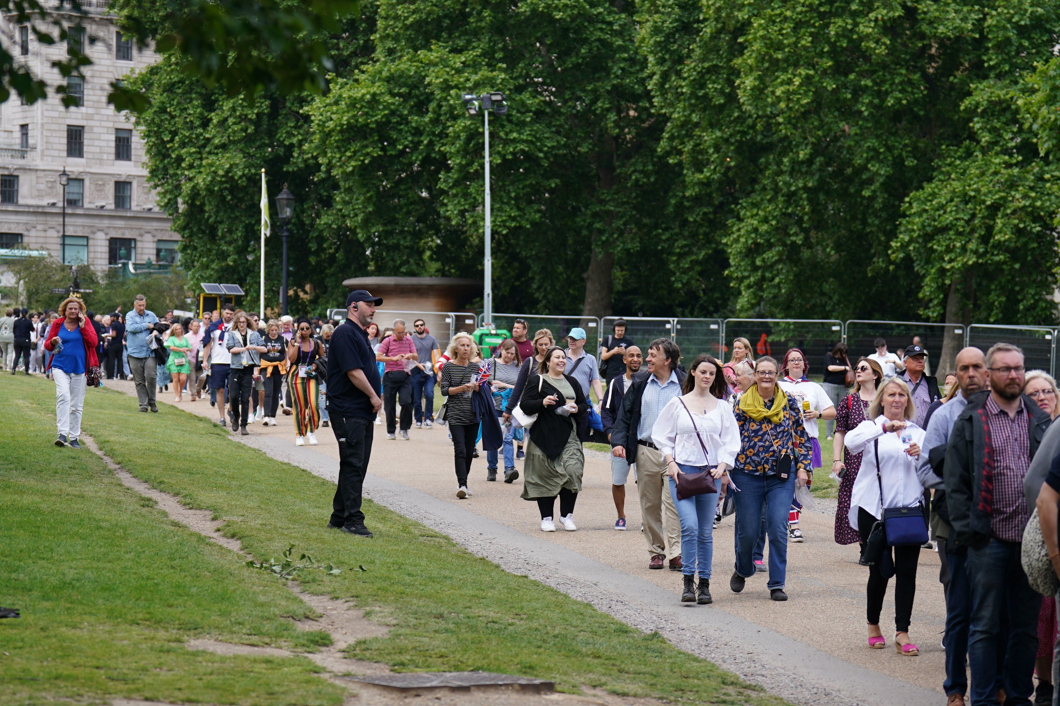 Ticket holders enter Green Park before the start of the Platinum Party at the Palace in front of Buckingham Palace