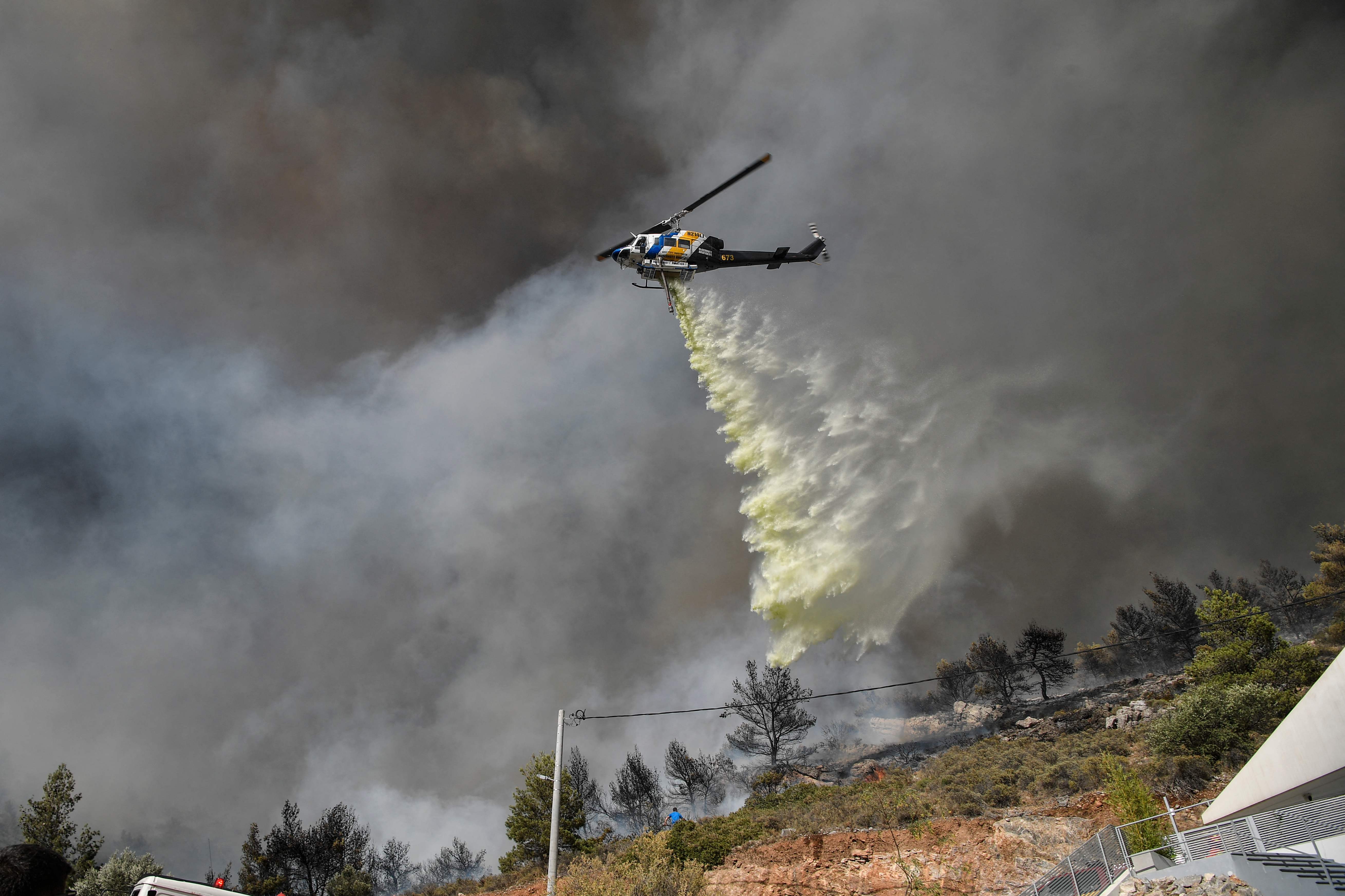 Four helicopters dropped tonnes of war in efforts to extinguish the fire