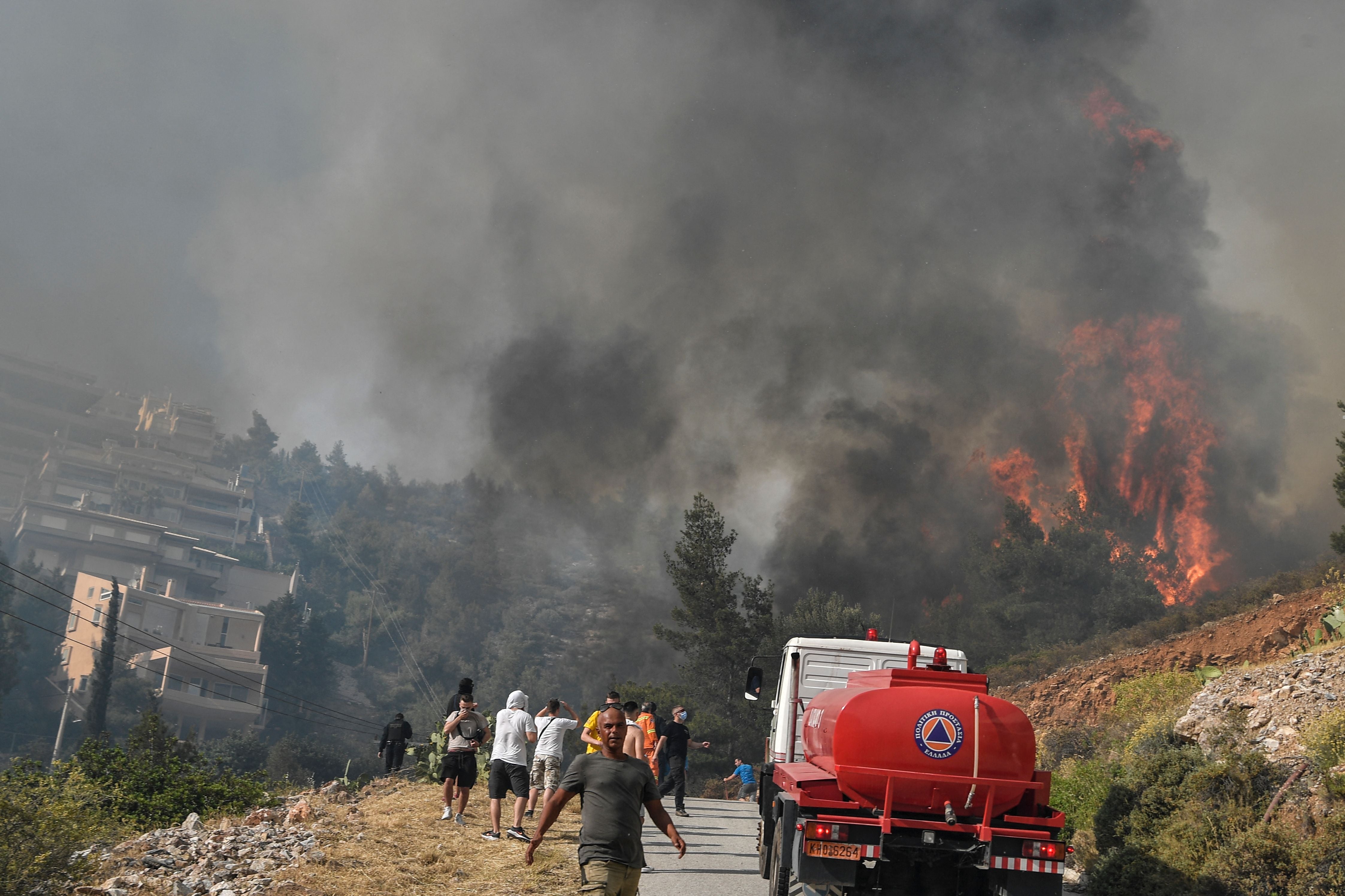Strong winds fanned the blaze quickly across the slopes of Mount Hymettus which overlooks the Greek capital
