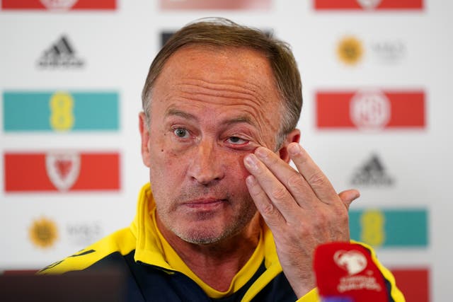 Ukraine manager Oleksandr Petrakov wiped away a tear during his press conference (Mike Egerton/PA)