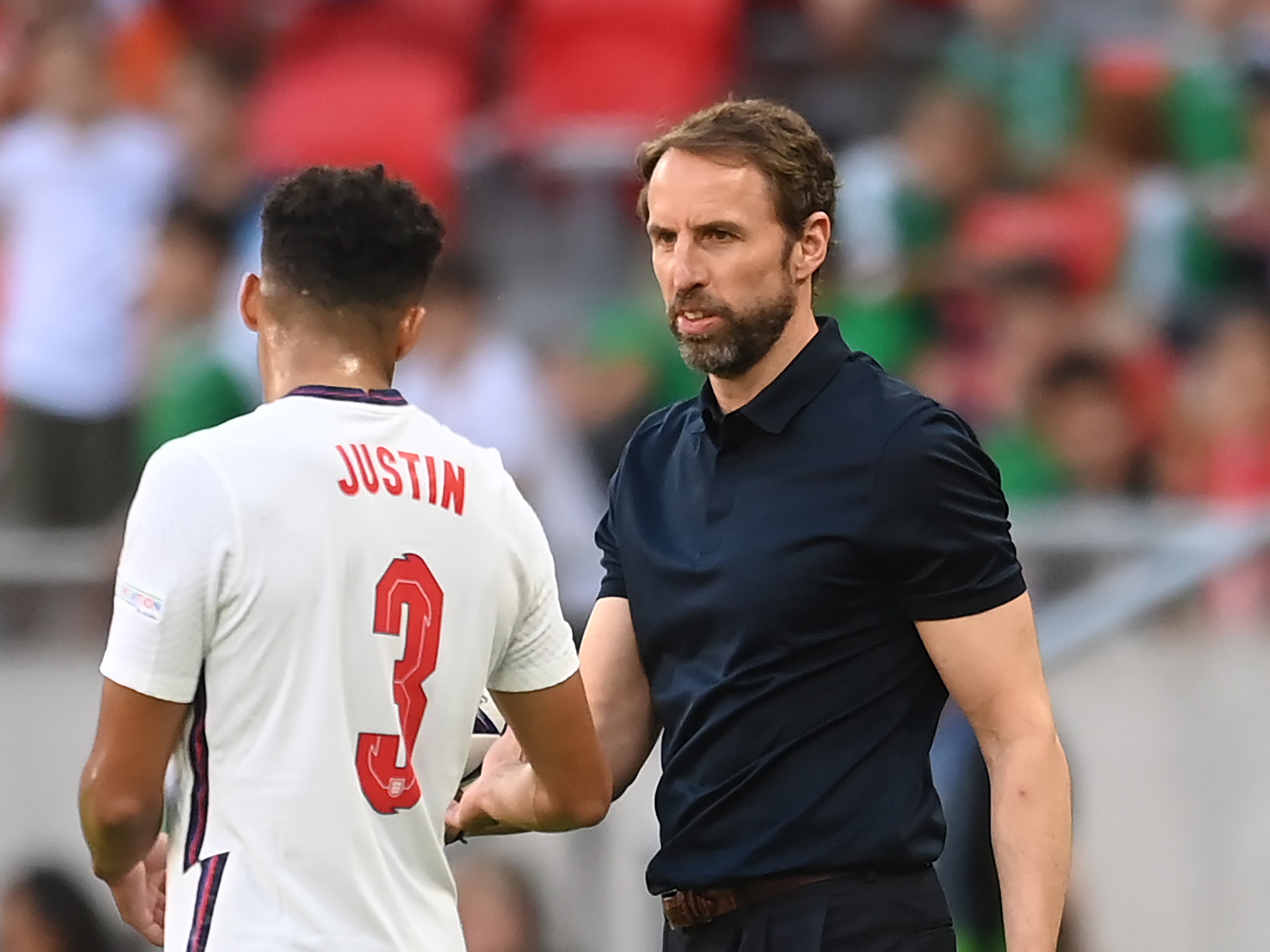 Gareth Southgate (right) handed England debuts to starters James Justin and Jarred Bowen