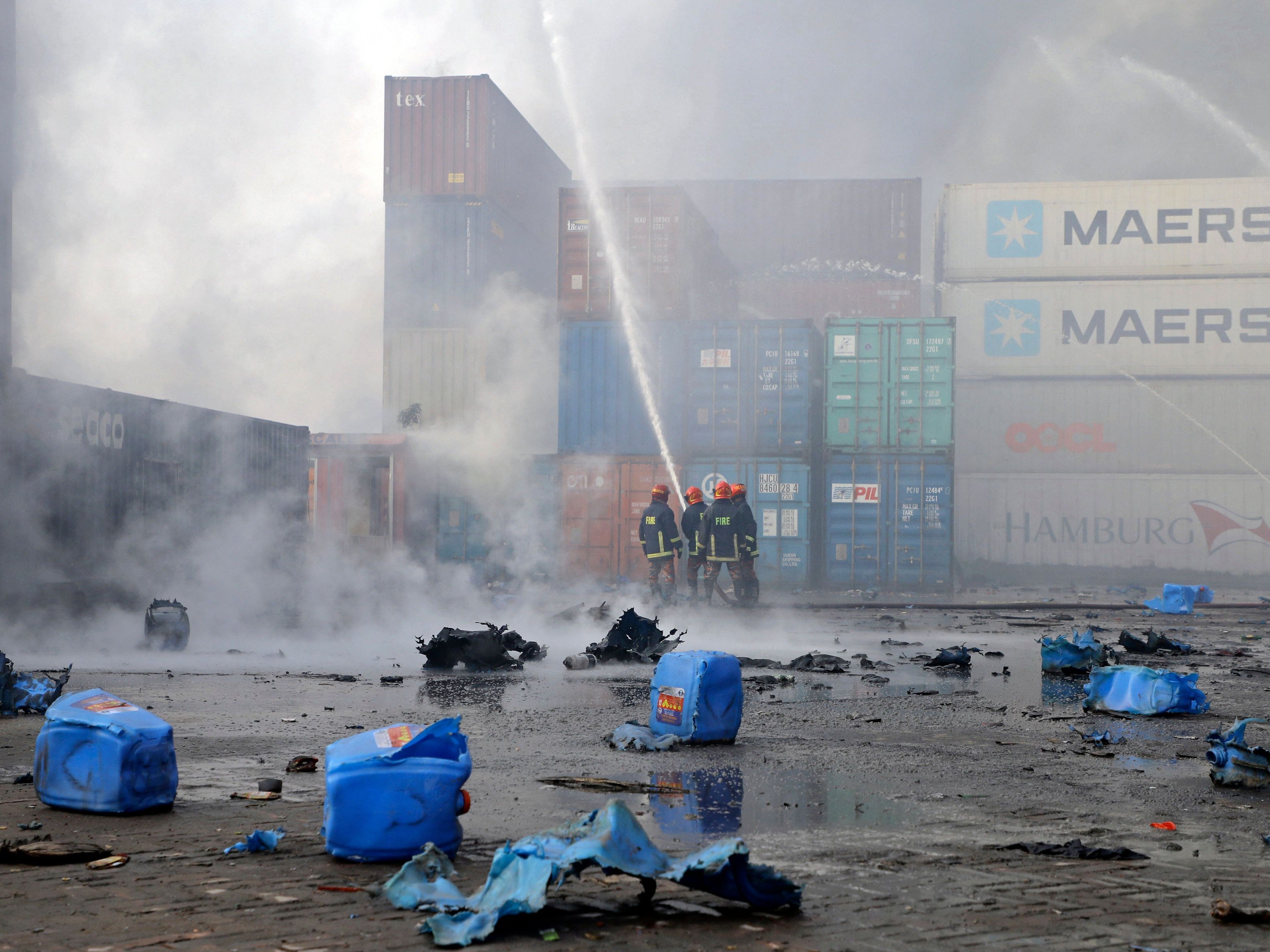 Firefighters try to extinguish a fire that broke out at a container storage facility in Sitakunda, about 40 km from the key port of Chittagong