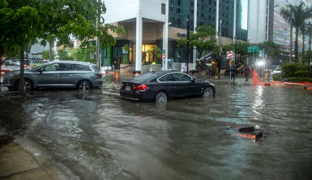 <p>Rainfall from Tropical Storm Alex floods the Brickell area near downtown Miami on 4 June</p>