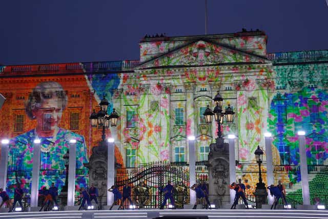 An image of the Queen is projected onto Buckingham Palace (Jacob King/PA)