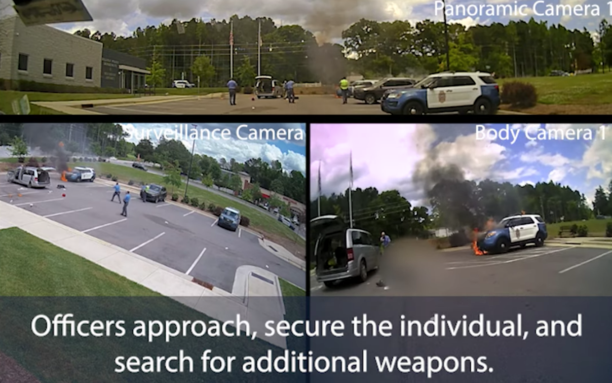 Newly released video footage from the Raleigh Police Department shows a man setting police cars ablaze before he was shot and killed by officers