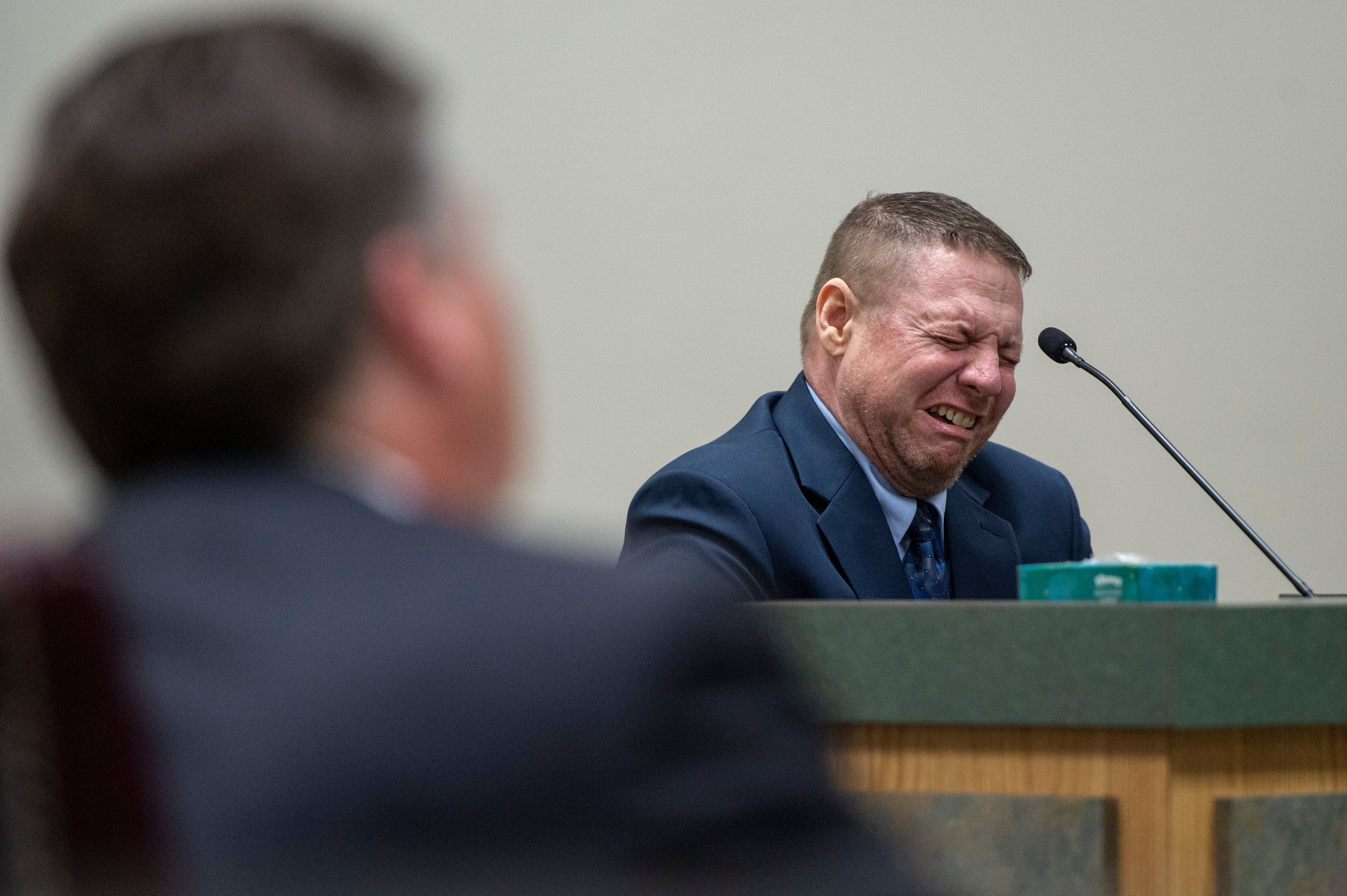 Jacob Blair Scott, who is accused of sexually assaulting a minor, cries out while on the witness stand after testifying about his family relationships.