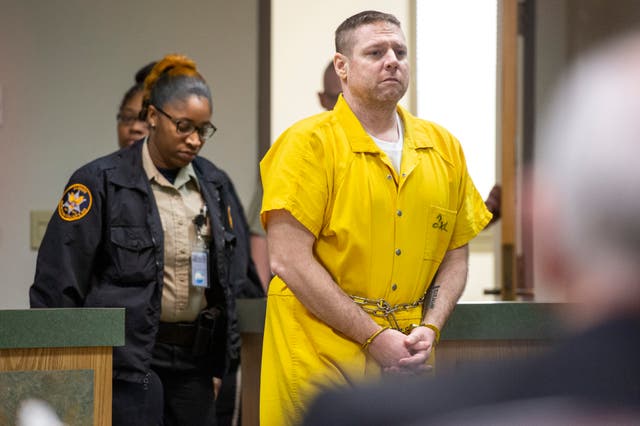 <p>Jacob Blair Scott is led into the courtroom for his sentencing in Pascagoula, Mississippi, on June 2, 2022. Scott was convicted of sexually assaulting a girl and impregnating her when he was 40 and she was 14, and was sentenced him to 85 years in prison. (Hannah Ruhoff/The Sun Herald via AP)</p>