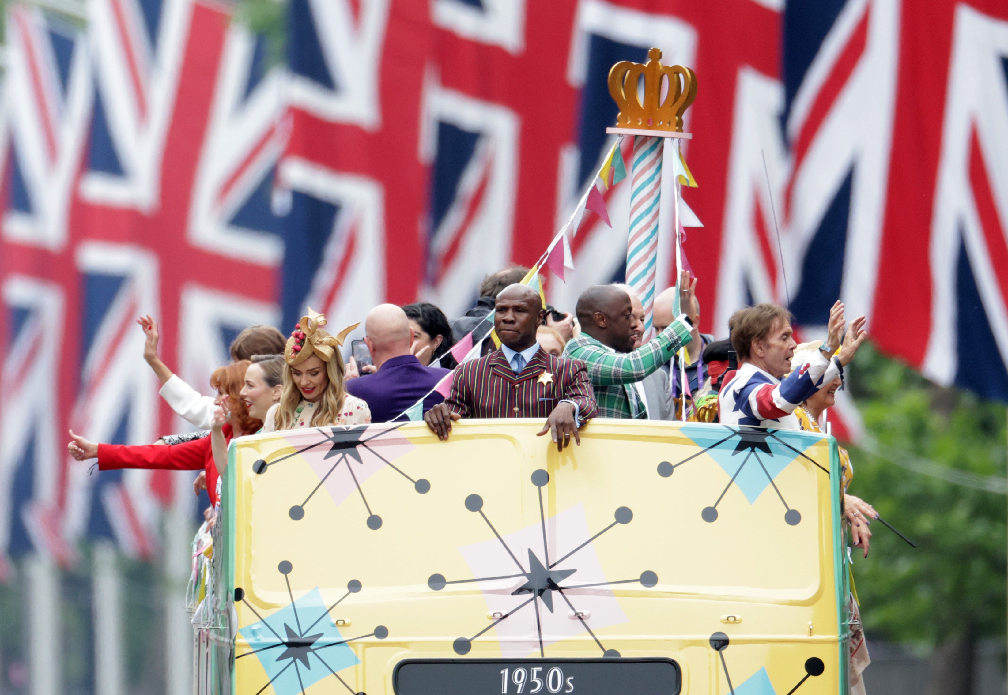 Catherine Jenkins, Chris Eubank, Giles Terera and Cliff Richard ride a bus along The Mall