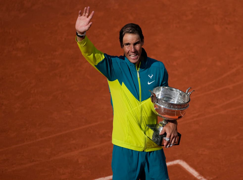 Rafael Nadal holds the French Open trophy (Christophe Ena/AP)