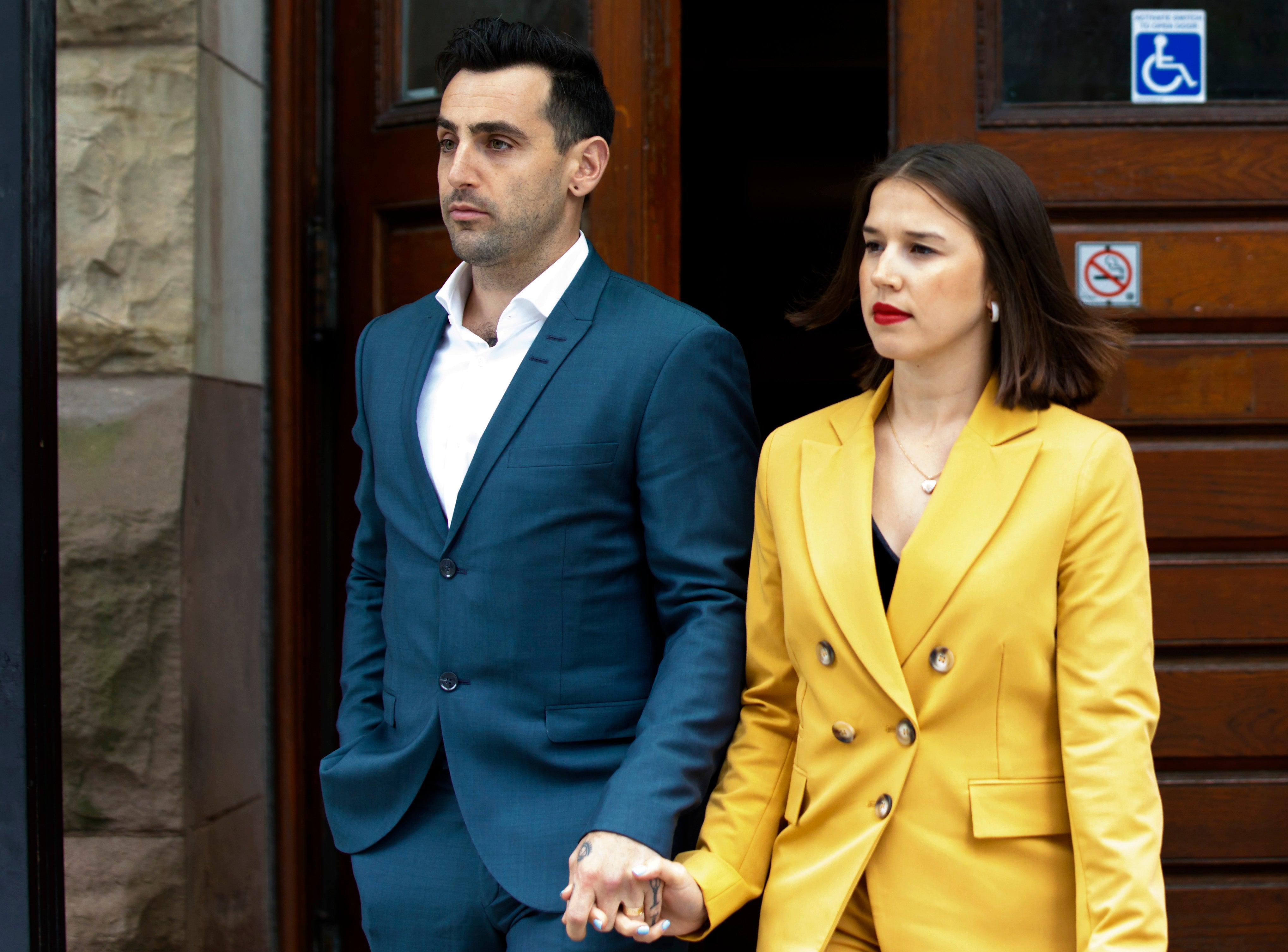 Jacob Hoggard leaves a Toronto courthouse alongside his wife Rebekah Asselstine