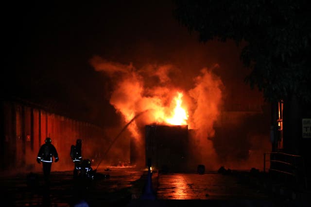 <p>Firefighters try to contain the fire caused by an explosion at a private Inland Container Depot in Chittagong, Bangladesh </p>