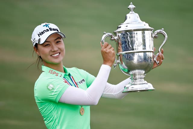 <p>Minjee Lee of Australia poses with the trophy after winning the 77th US Women's Open at Pine Needles, North Carolina, on Sunday </p>