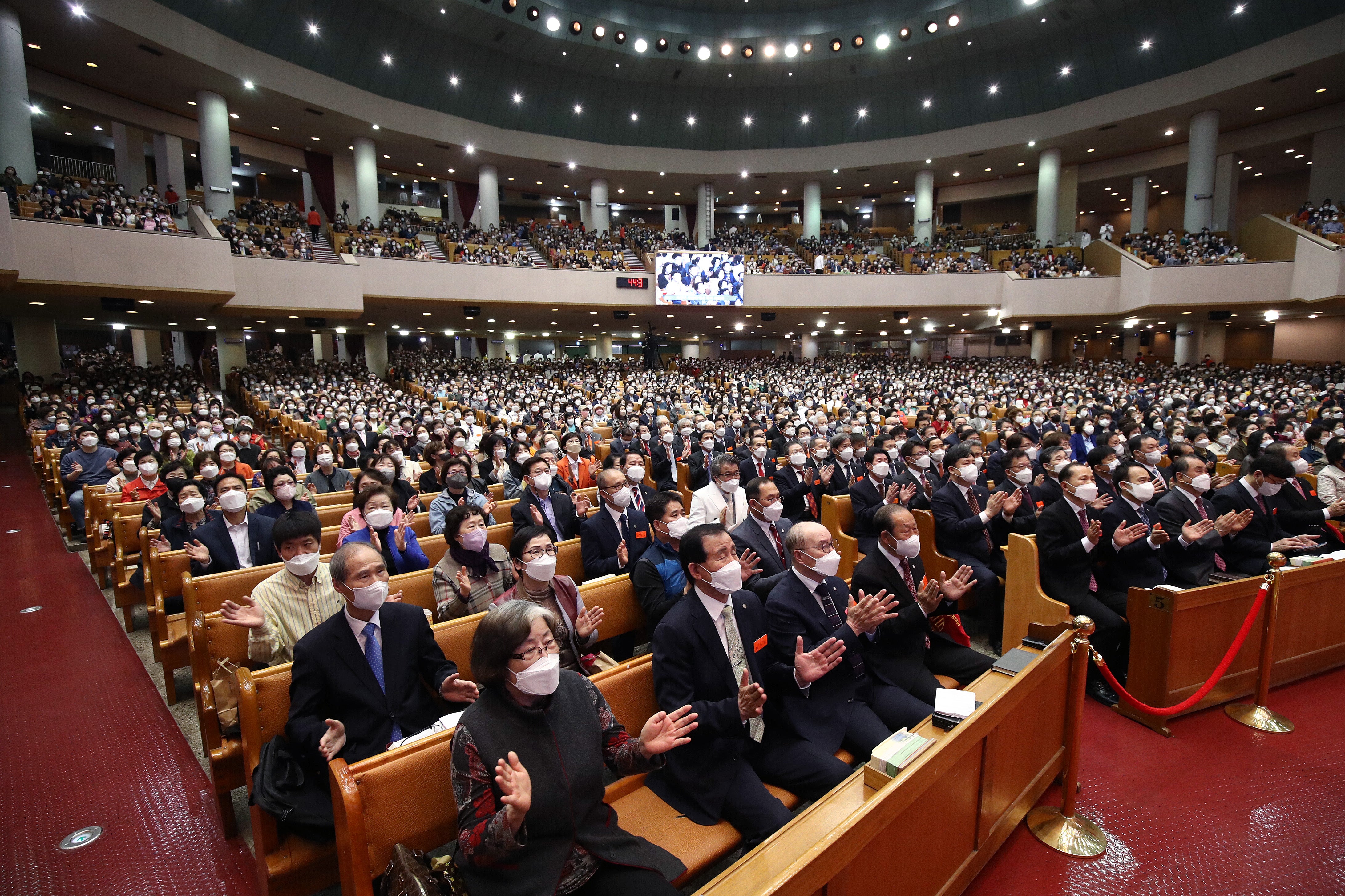 South Korean Christians wearing masks attend an Easter service at Yoido Full Gospel Church