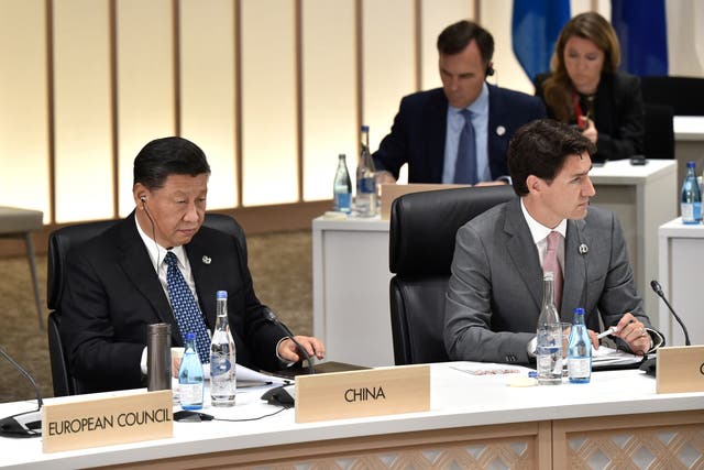 <p>File: China's president Xi Jinping (L) and Canada's prime Minister Justin Trudeau at a G20 summit </p>