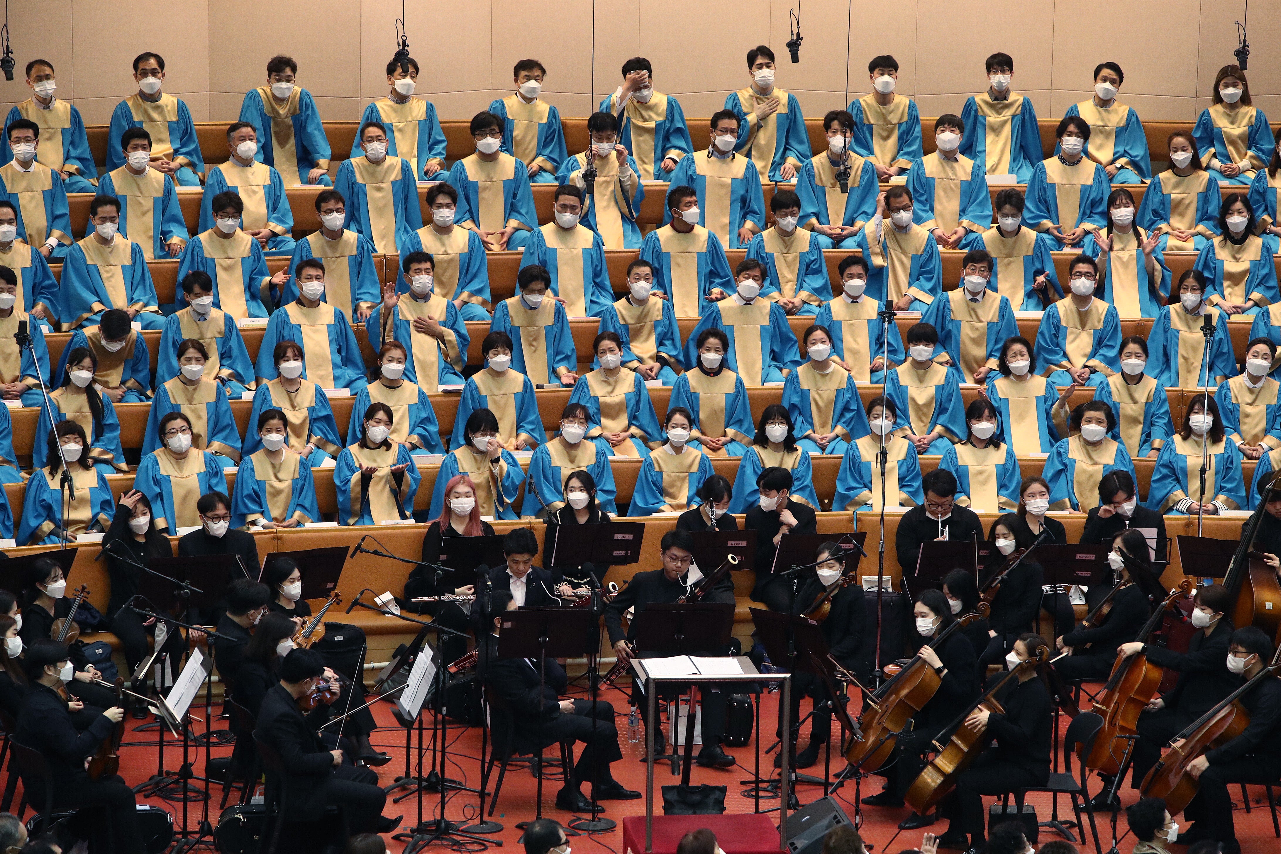 Church choir members wearing masks attend an Easter service at Yoido Full Gospel Church