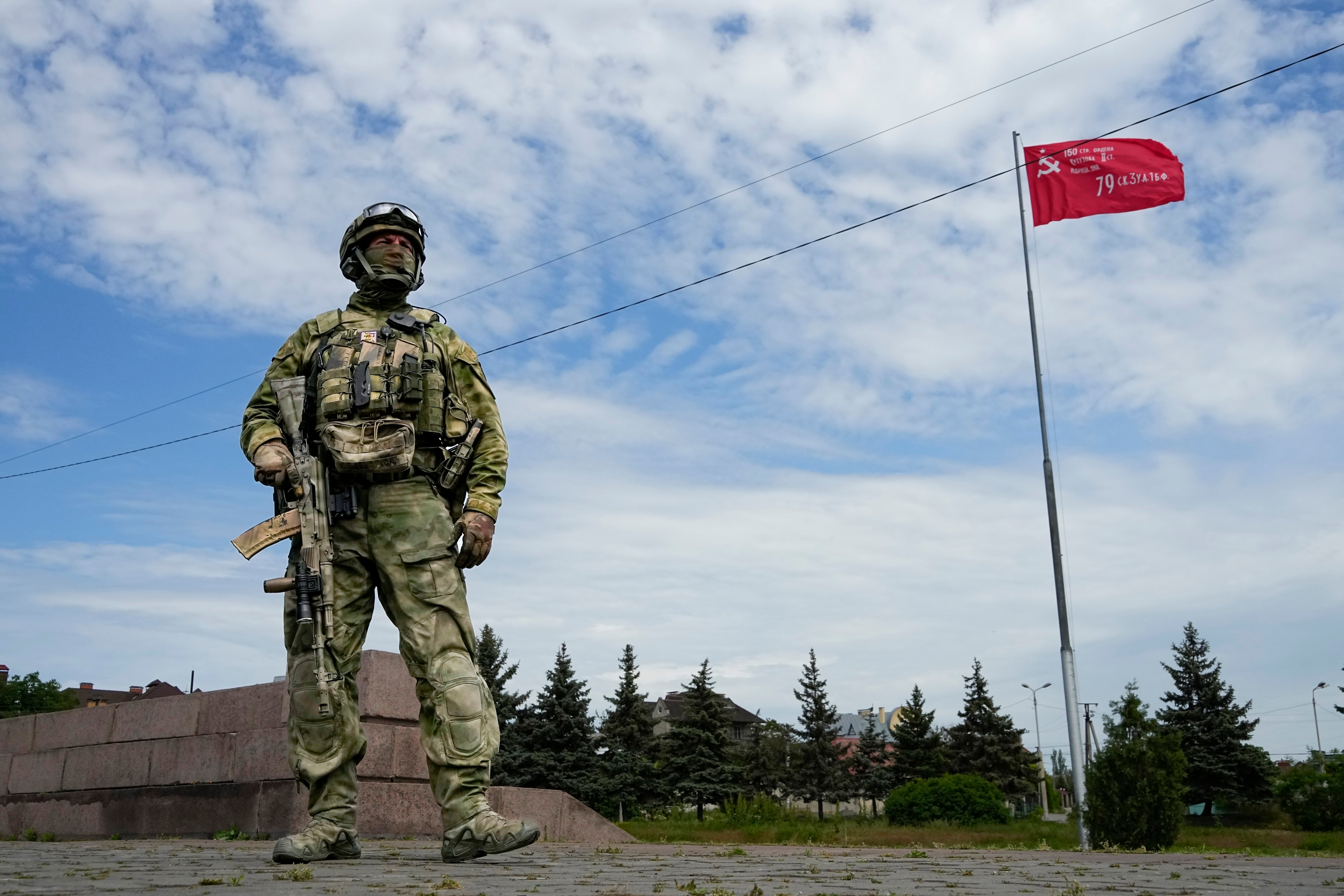 A Russian soldier stands guard in the Moscow-controlled city of Kherson, south Ukraine on 20 May, 2022