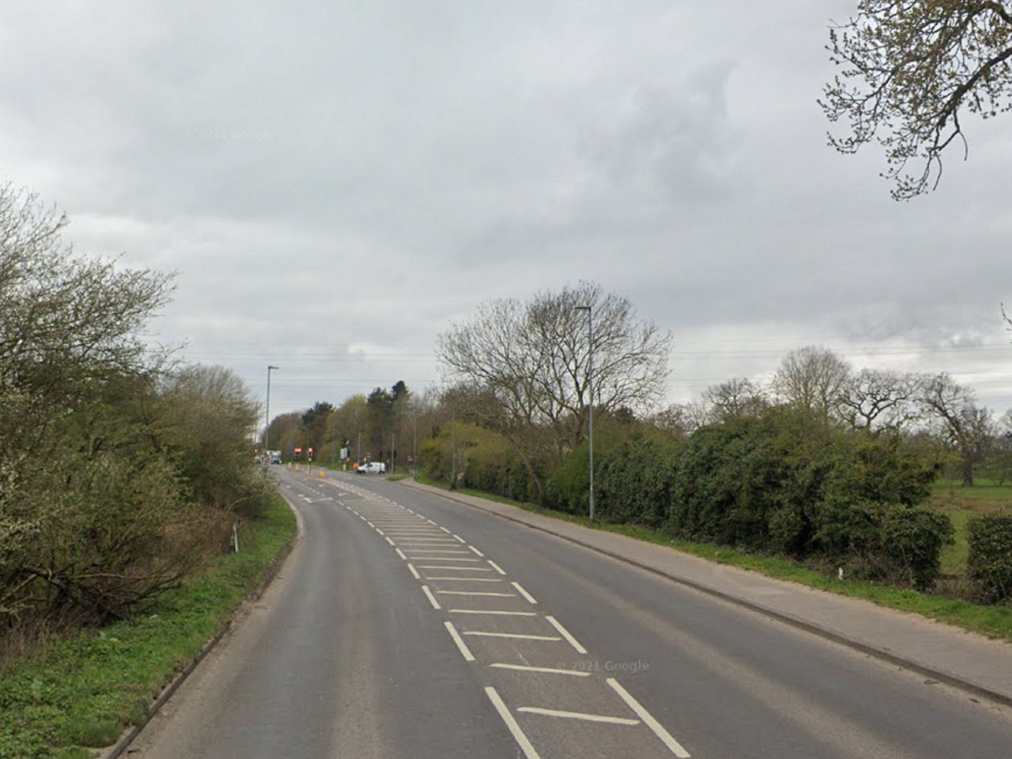 A woman has died after falling from the rear seat of a car on the B1108 in Norfolk