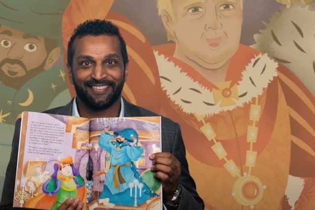 <p>From Trump administration official Kash Patel holds open a copy of his children’s book ‘The Plot Against the King’ </p>