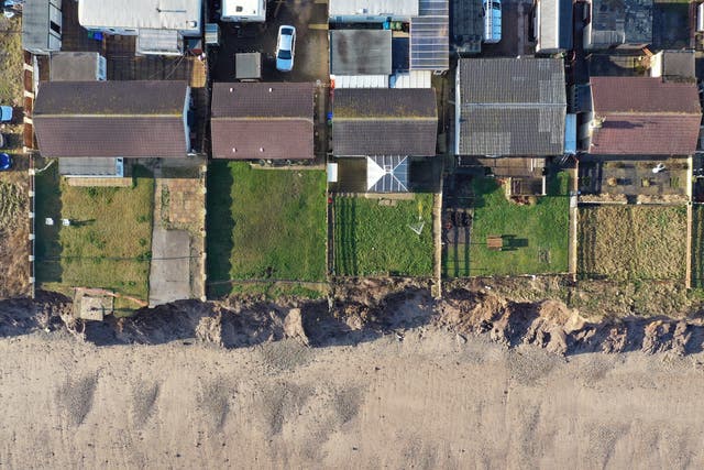 Houses on the coastline in Skipsea, East Yorkshire (PA)