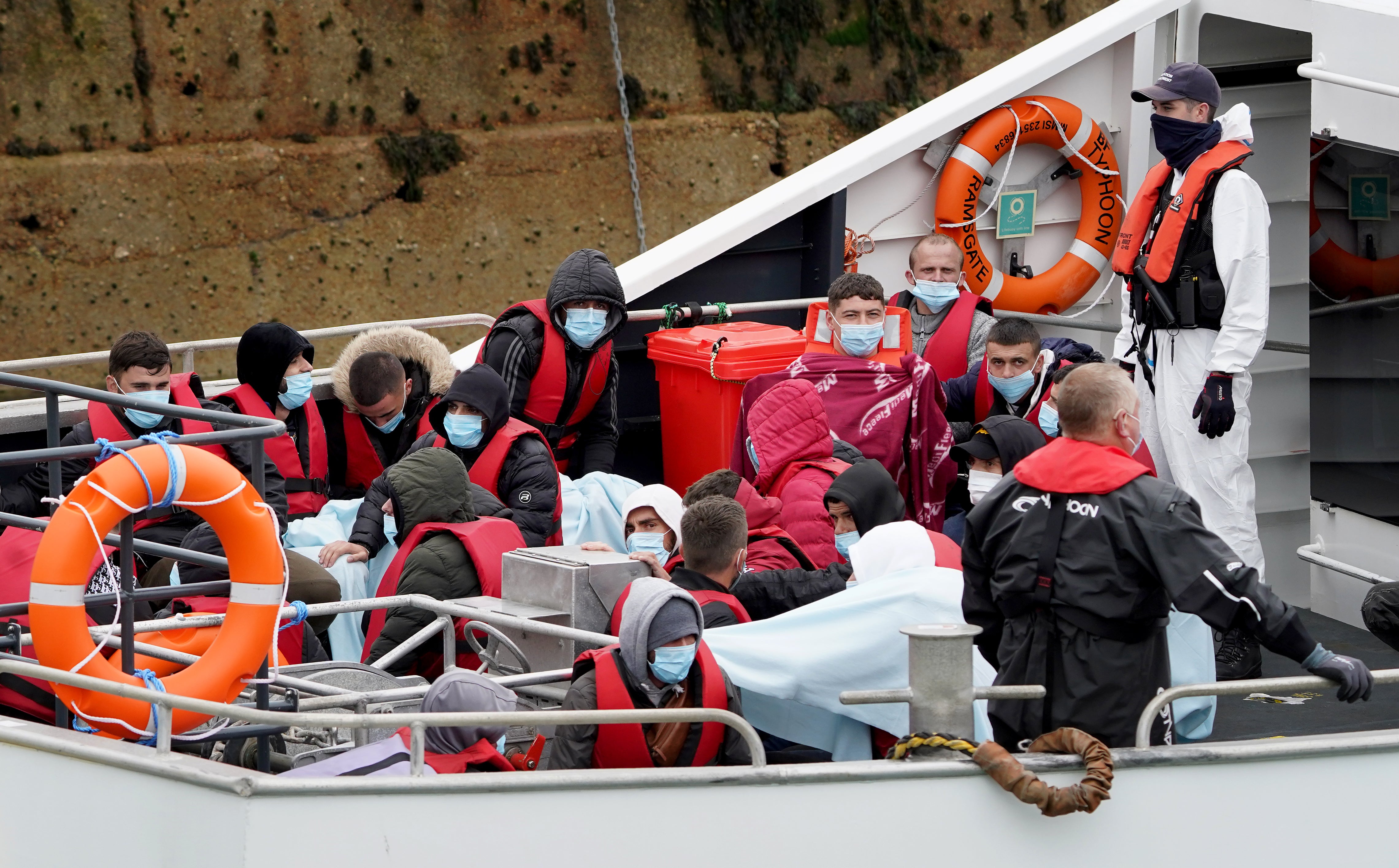 A group of people thought to be migrants are brought in to Dover (Gareth Fuller/PA)