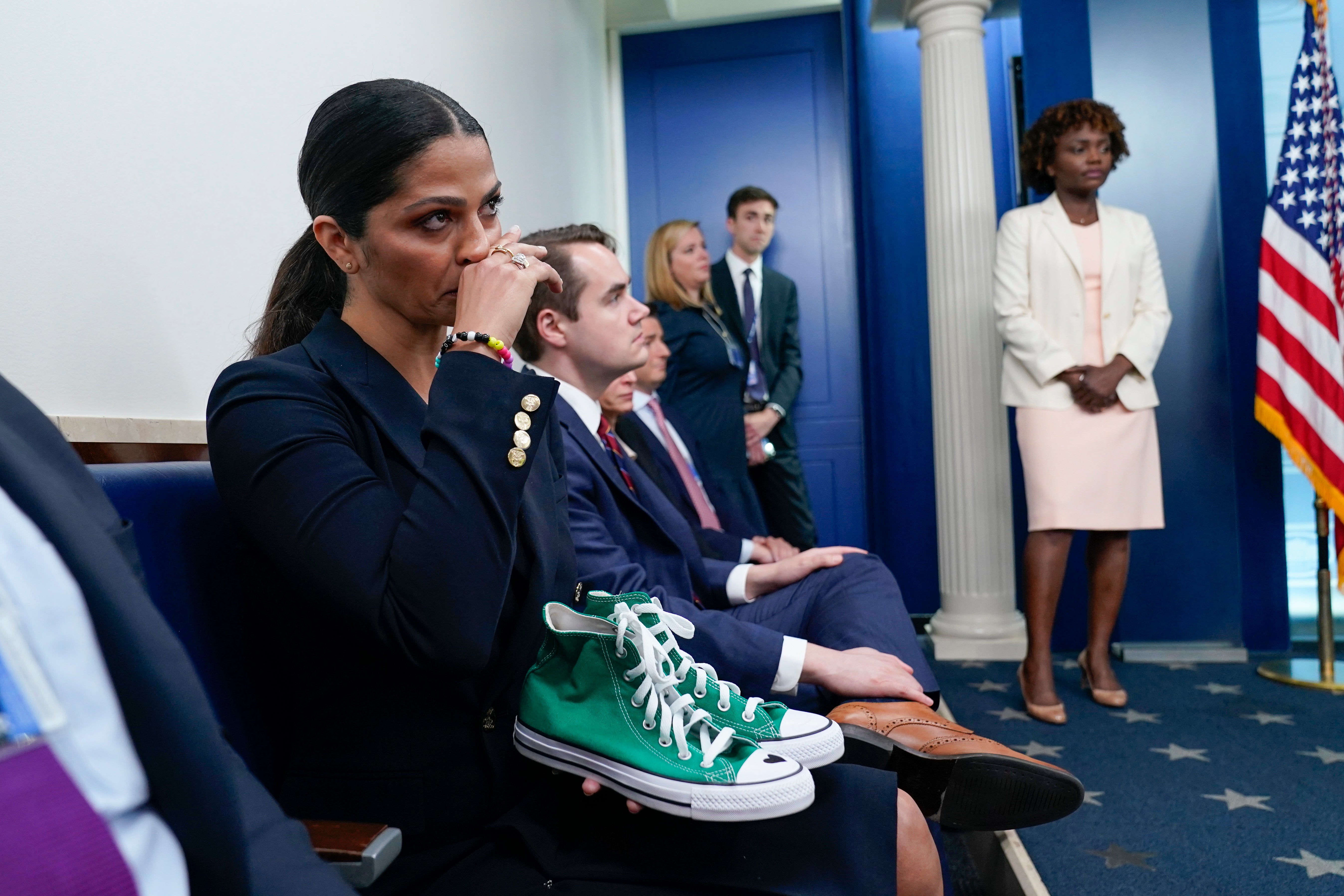 Camila Alves McConaughey holds the lime green Converse tennis shoes that were worn by Uvalde shooting victim Maite Yuleana Rodriguez, 10