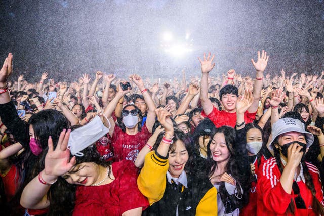 <p>Fans get sprayed by water at a Psy concert in Seoul, South Korea last month. The pop star is reportedly planning on using hundreds of tons of water during some upcoming concerts </p>