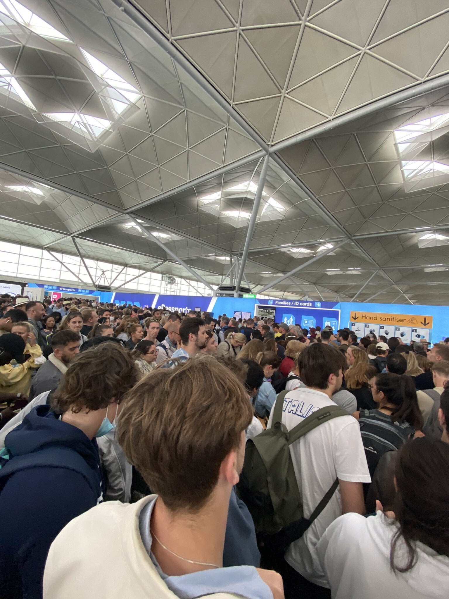 People queuing at Stansted airport (@CJvsn)