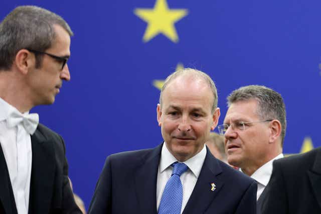 <p>Micheal Martin, centre, was speaking during a visit to Strasbourg </p>