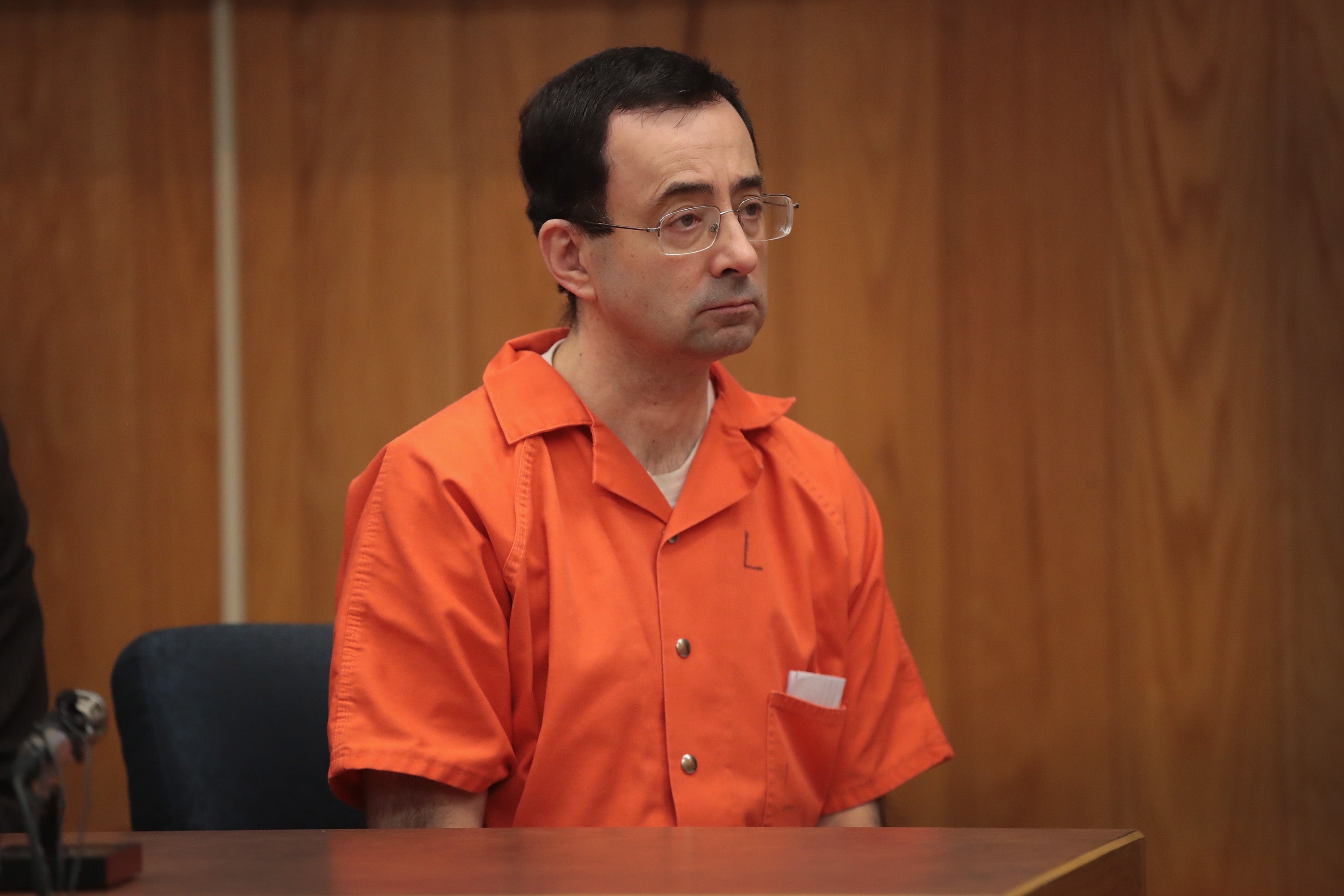 Larry Nassar sits in court listening to statements before being sentenced by Judge Janice Cunningham for three counts of criminal sexual assault in Eaton County Circuit Court on February 5, 2018