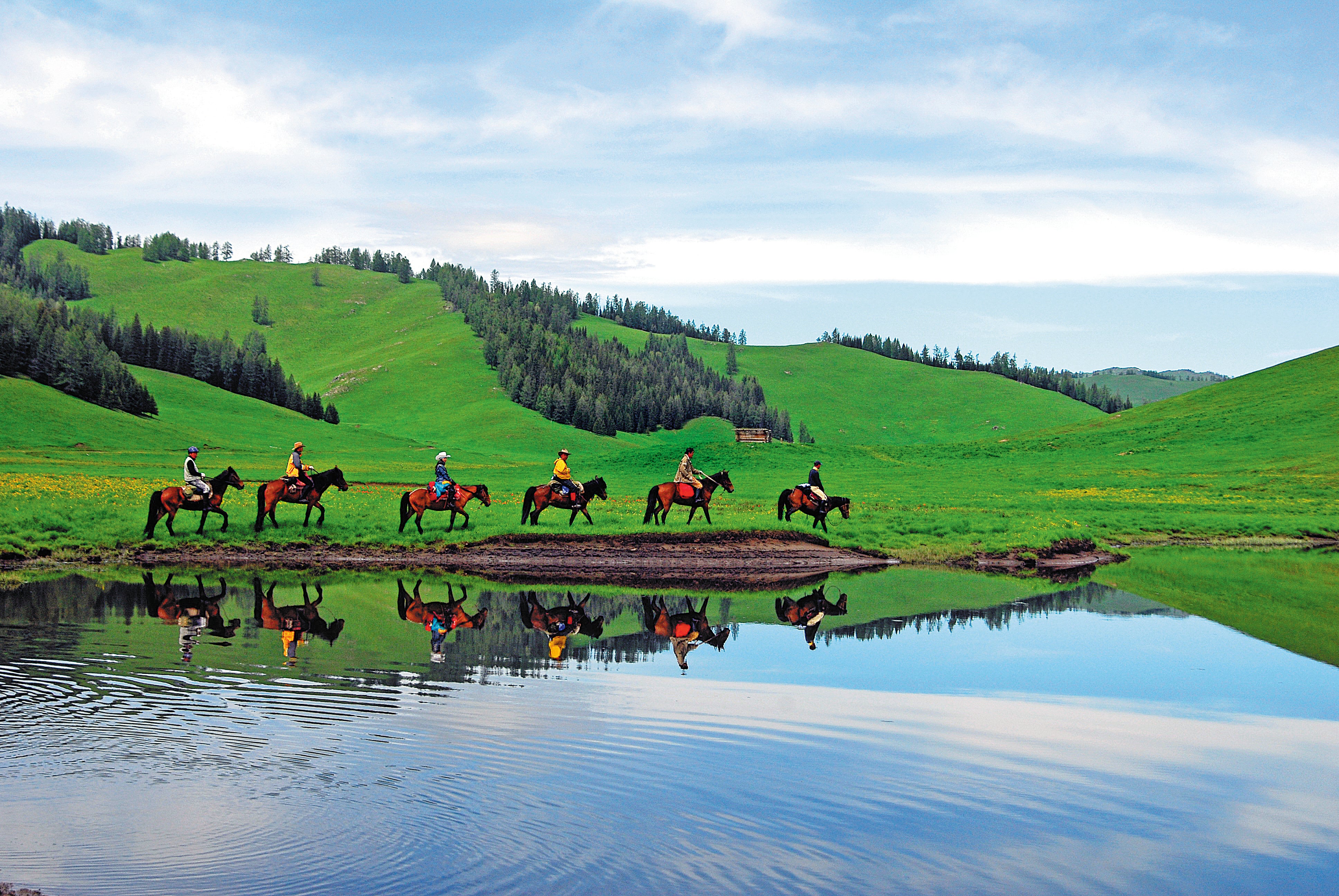 Tourists on a riding tour in the Xinjiang Uygur autonomous region