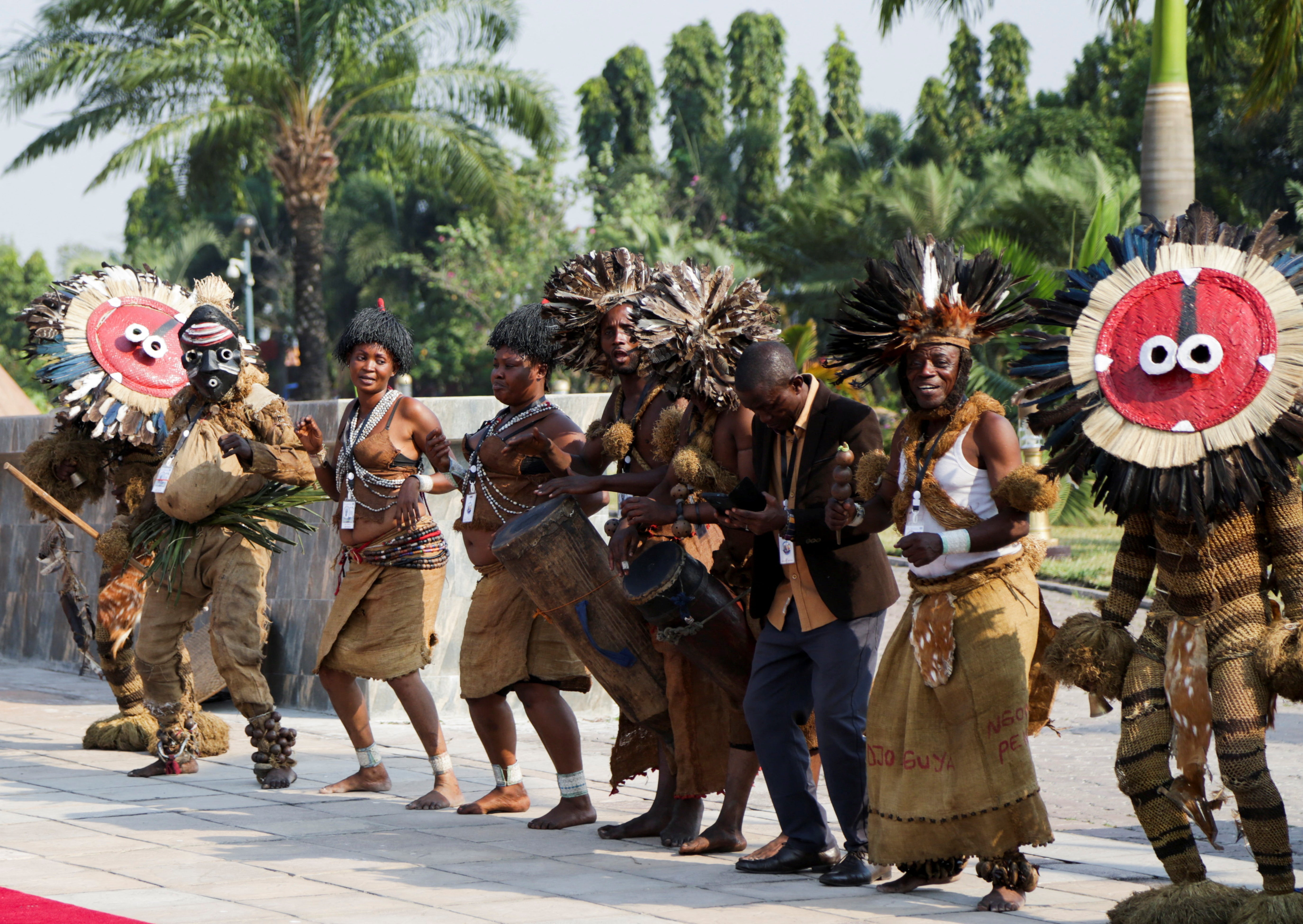 Traditional dancers perform as a welcome King Philippe and Queen Mathilde