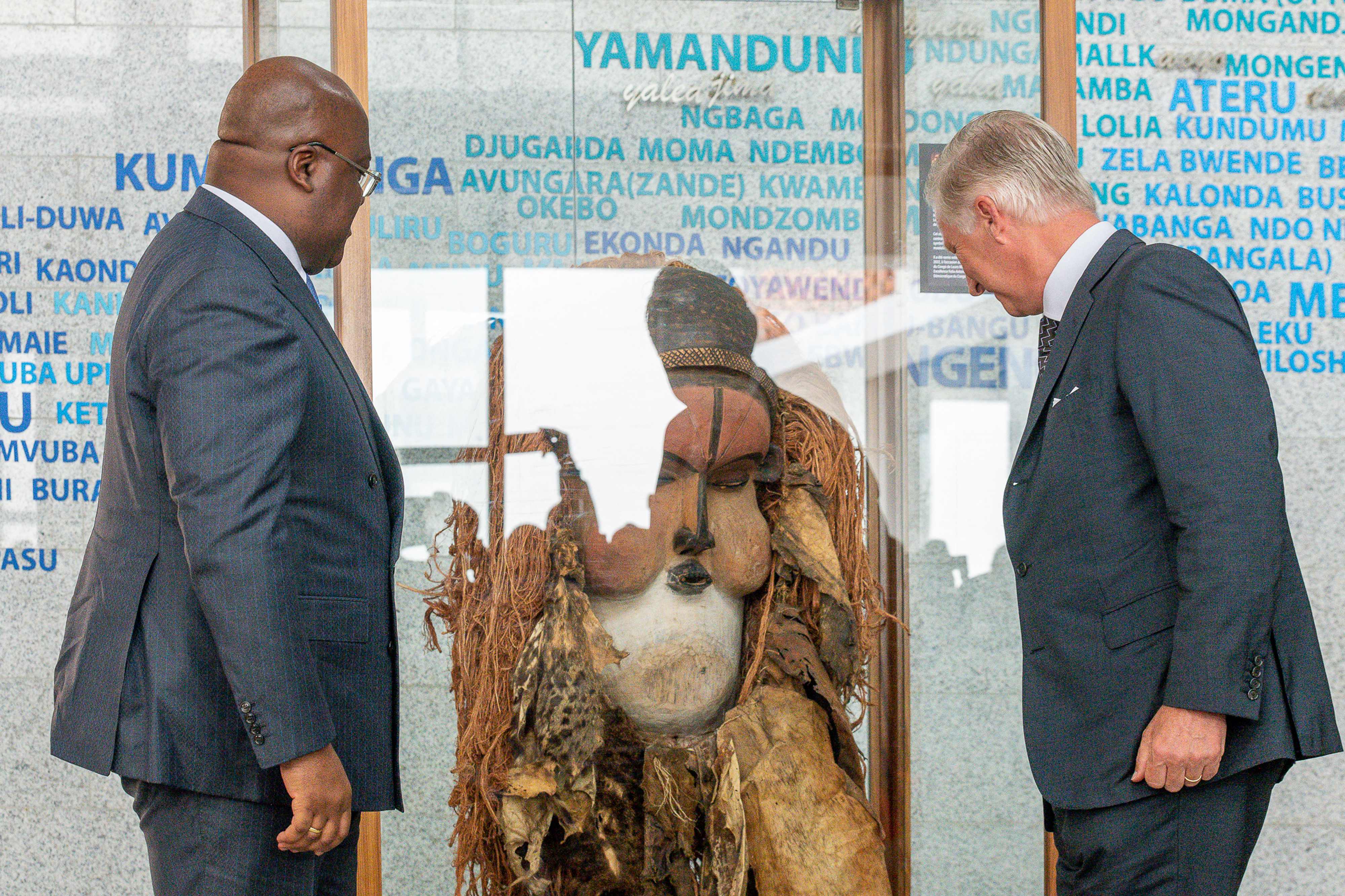 Belgium’s King Philippe returns a traditional mask to Congo president Felix Tshisekedi (left) in Kinshasa