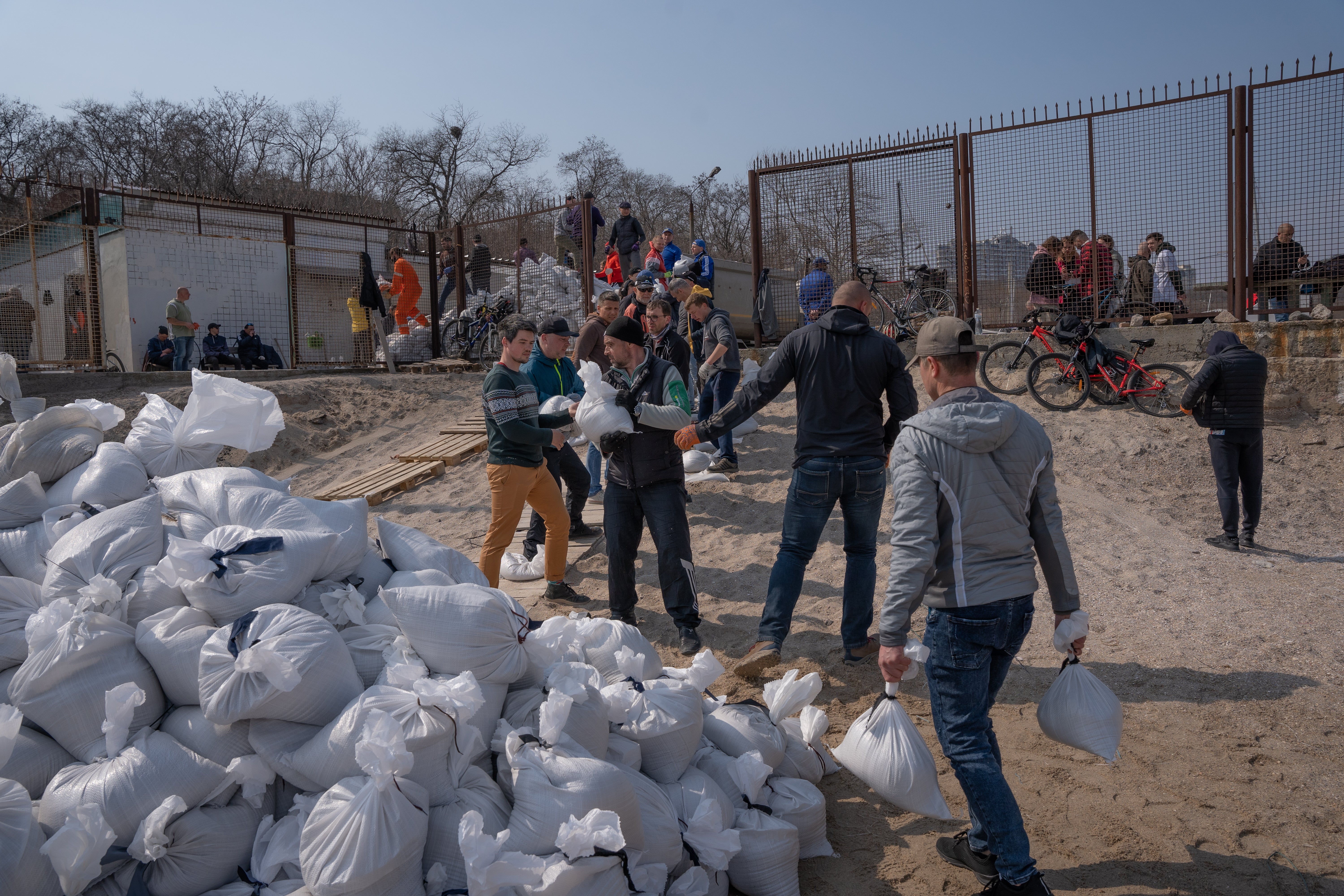 Hundreds of volunteers gather each day to make sandbags