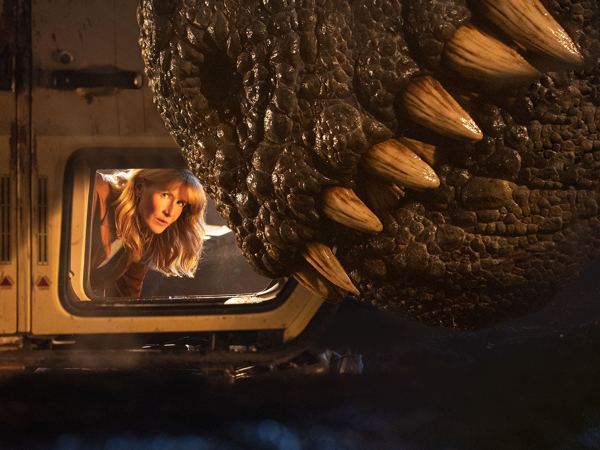 Laura Dern and a really big dinosaur in ‘Jurassic World Dominion’